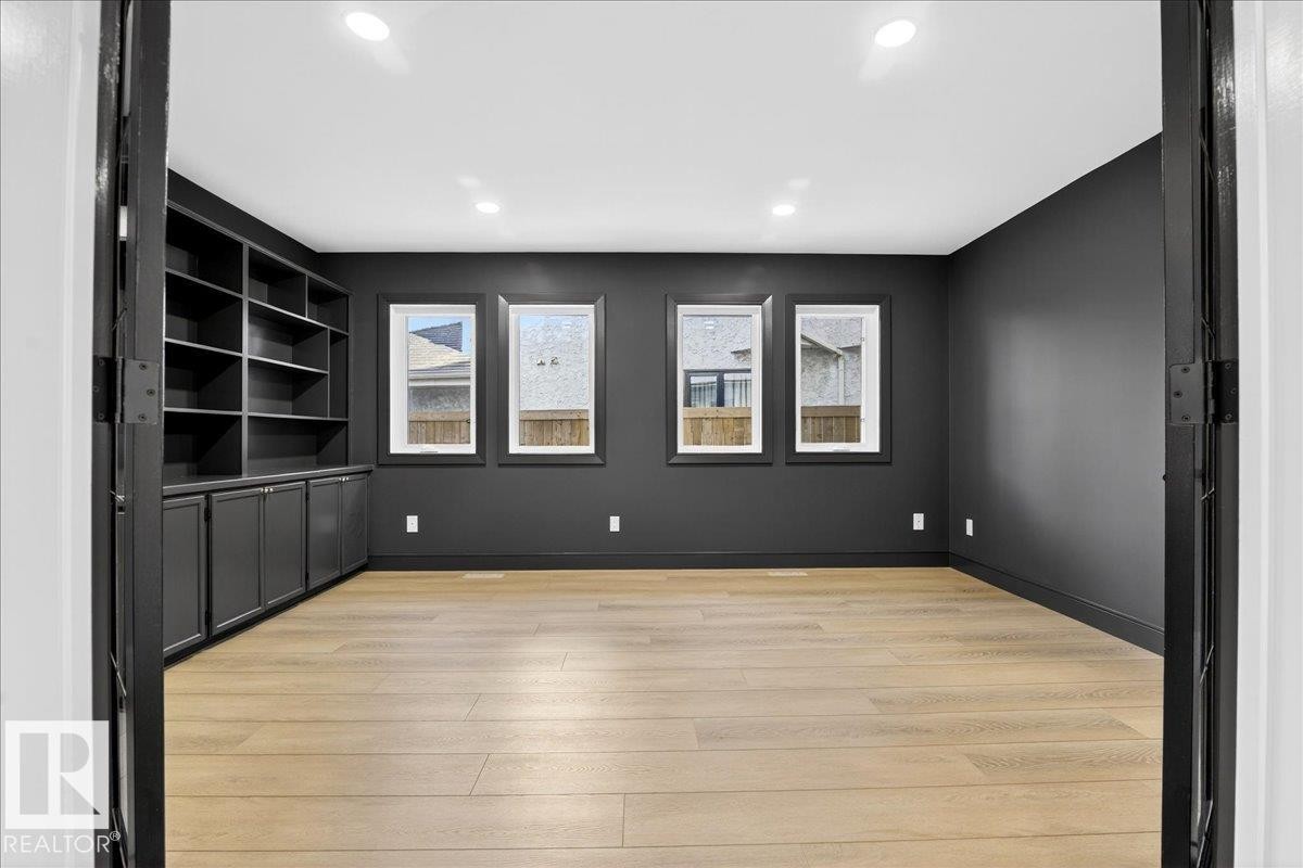 Unfurnished room with light wood-style floors, built in features, and recessed lighting - 218 Omand Drive, Edmonton, AB - Indoor Photo Showing Other Room