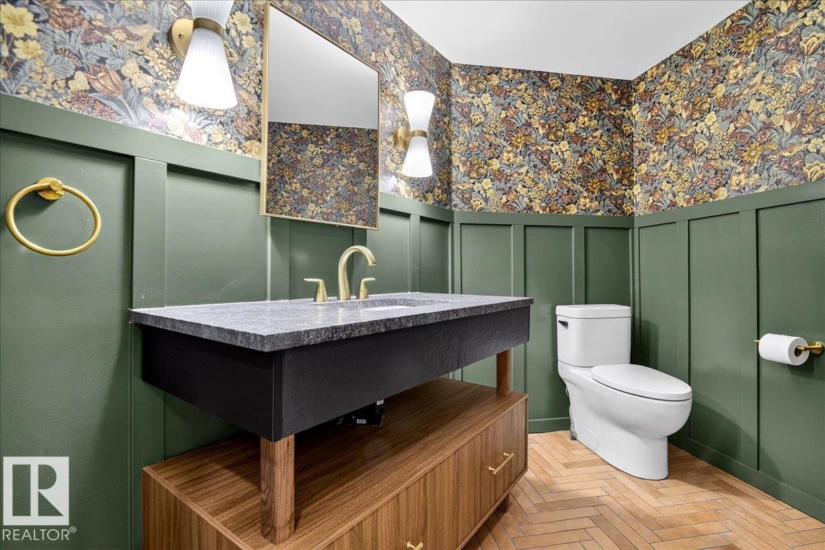 Bathroom featuring a decorative wall, vanity, wallpapered walls, and a wainscoted wall - 218 Omand Drive, Edmonton, AB - Indoor Photo Showing Bathroom