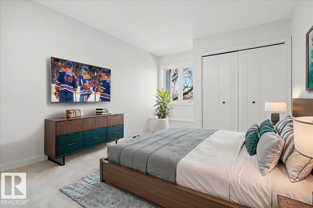 Bedroom featuring light colored carpet and a closet - 218 Omand Drive, Edmonton, AB - Indoor Photo Showing Bedroom