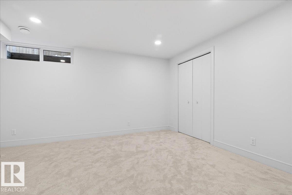 Unfurnished bedroom featuring carpet flooring, a closet, and recessed lighting - 218 Omand Drive, Edmonton, AB - Indoor Photo Showing Other Room