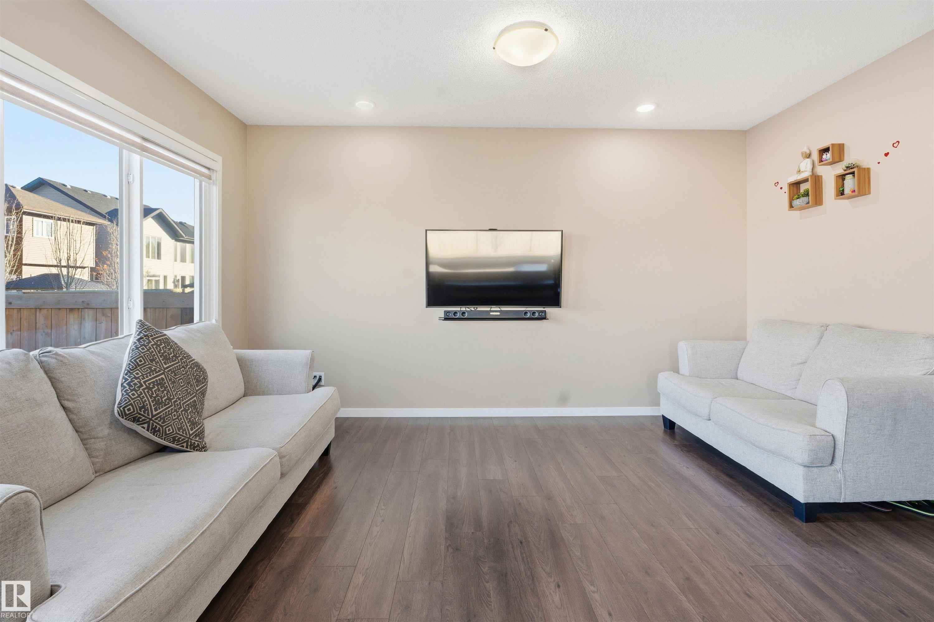 Living room featuring dark wood finished floors and recessed lighting - 5003 Andison Close, Edmonton, AB - Indoor Photo Showing Living Room