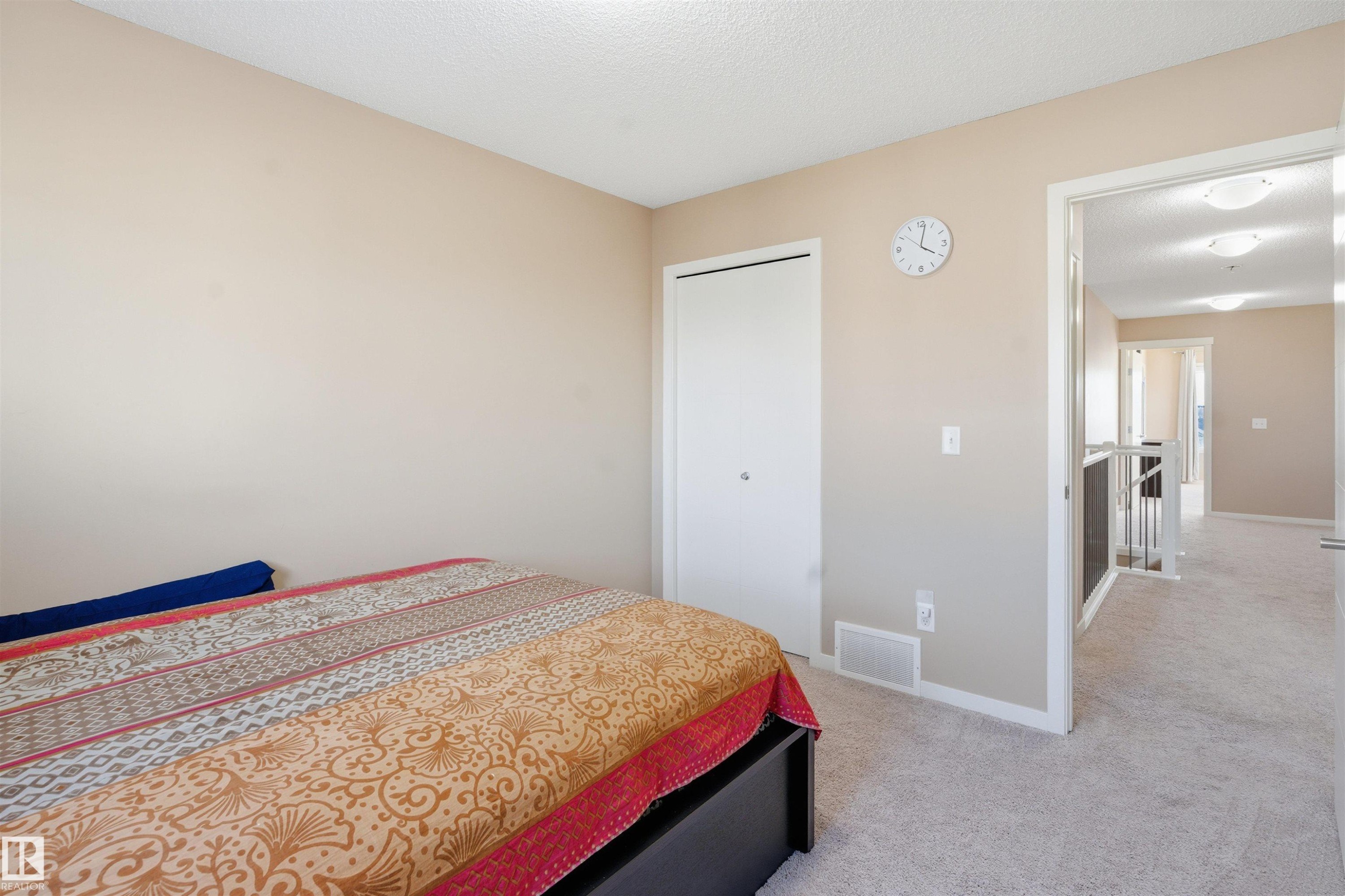Bedroom with light carpet and a textured ceiling - 5003 Andison Close, Edmonton, AB - Indoor Photo Showing Bedroom