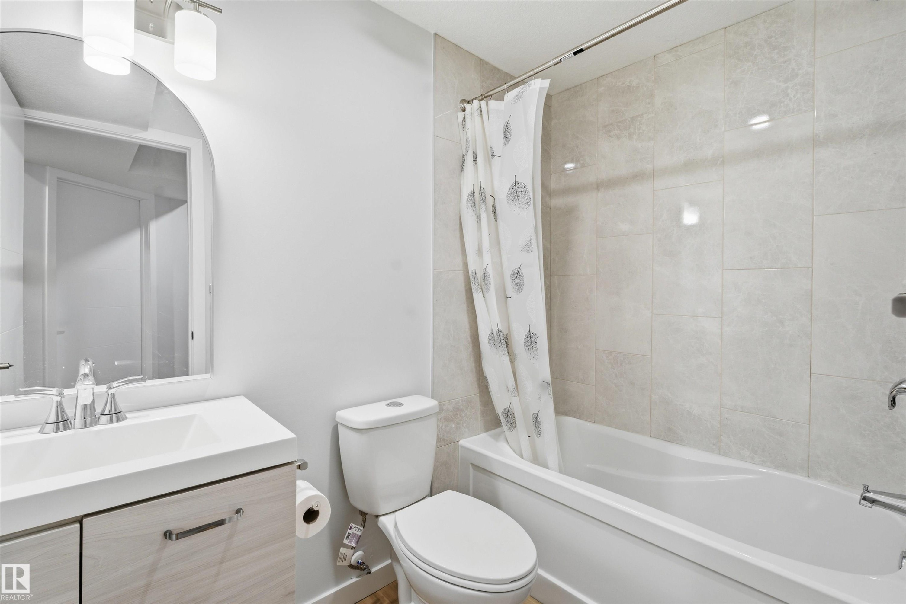 Full bath featuring vanity and shower / tub combo - 5003 Andison Close, Edmonton, AB - Indoor Photo Showing Bathroom