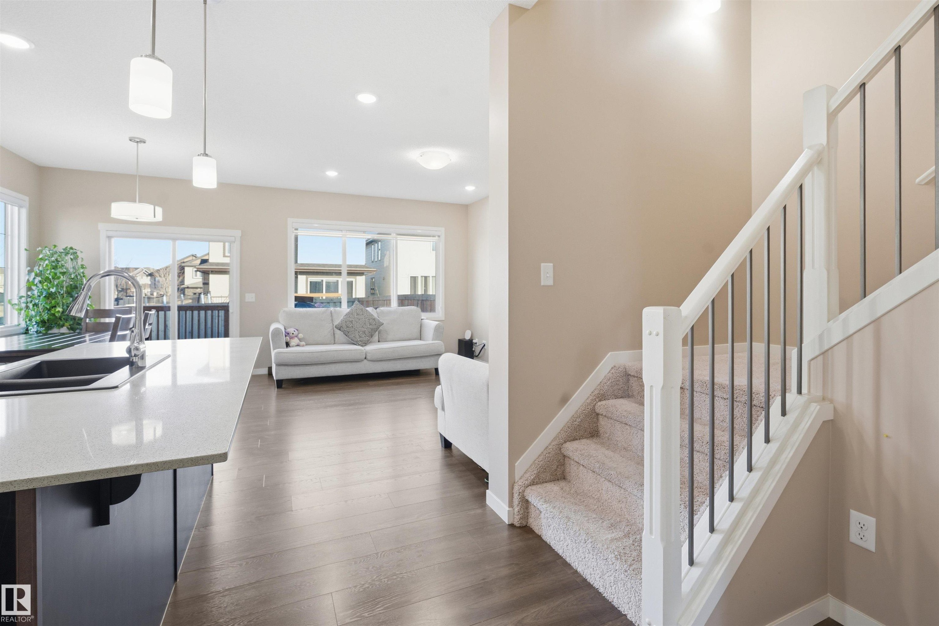 Staircase with wood finished floors and recessed lighting - 5003 Andison Close, Edmonton, AB - Indoor Photo Showing Other Room