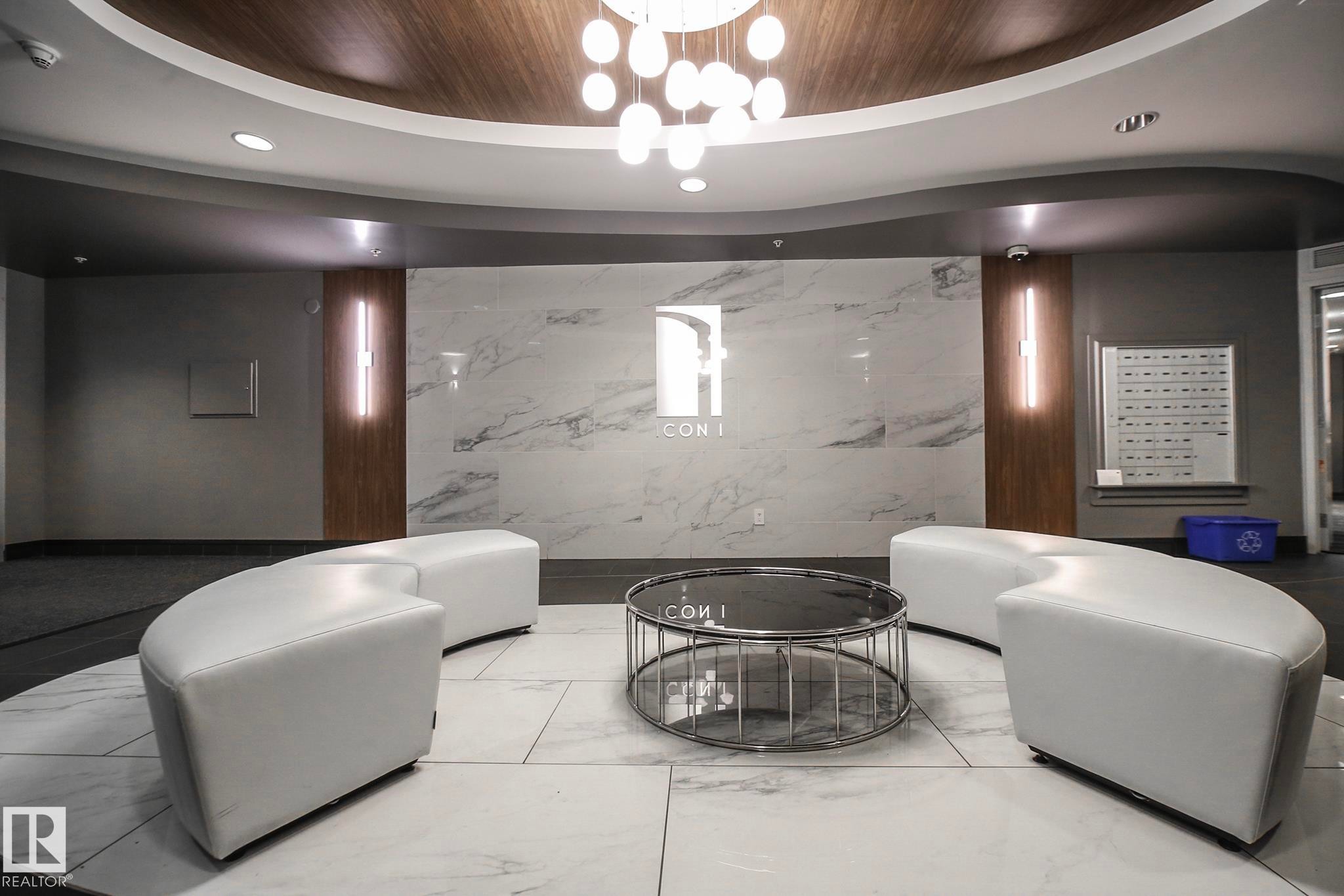 Living area with wood ceiling and hanging lights - 2005 10136 104 Street, Edmonton, AB - Indoor Photo Showing Other Room