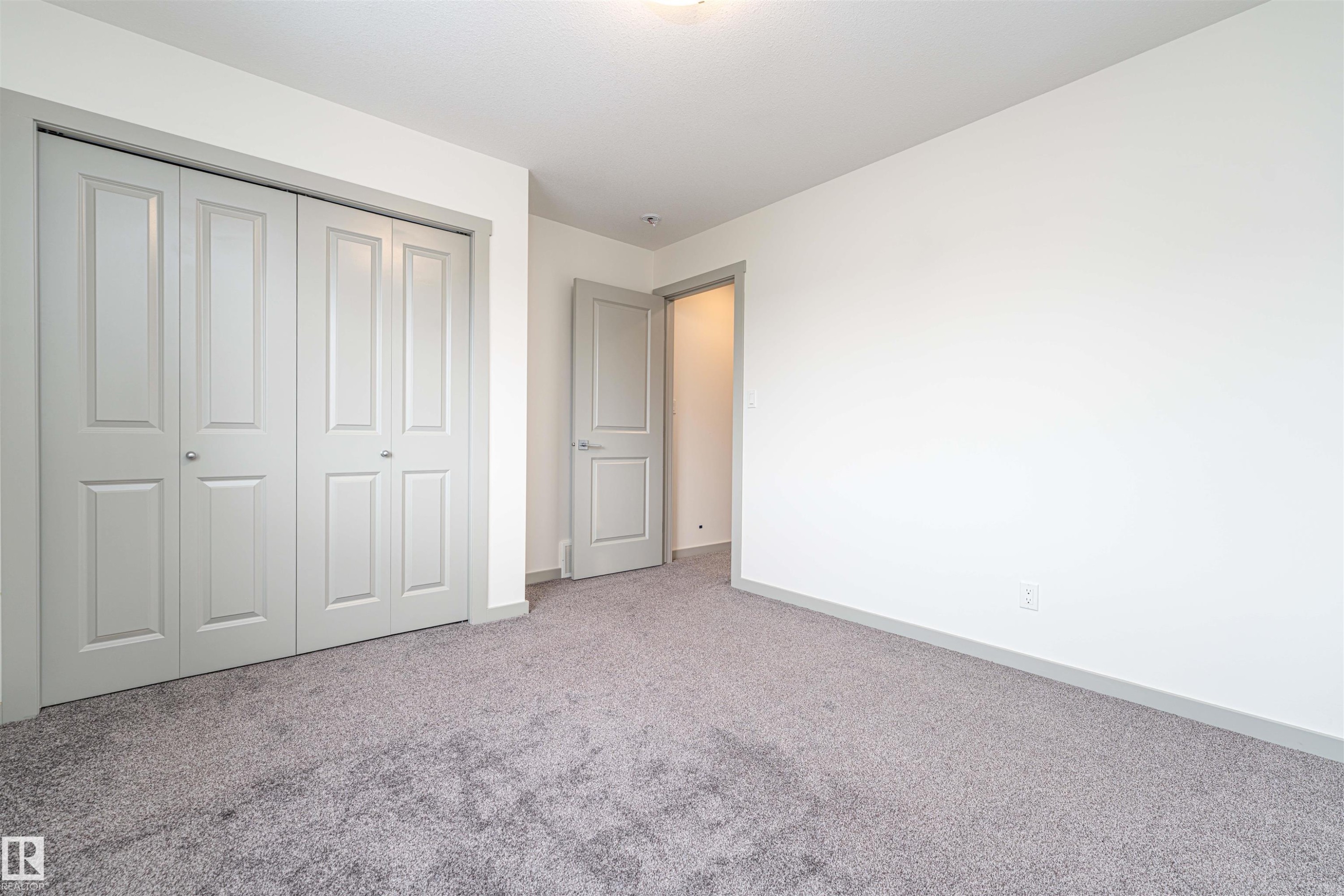 Unfurnished bedroom with carpet and a closet - 2330 Kelly Circle, Edmonton, AB - Indoor Photo Showing Other Room