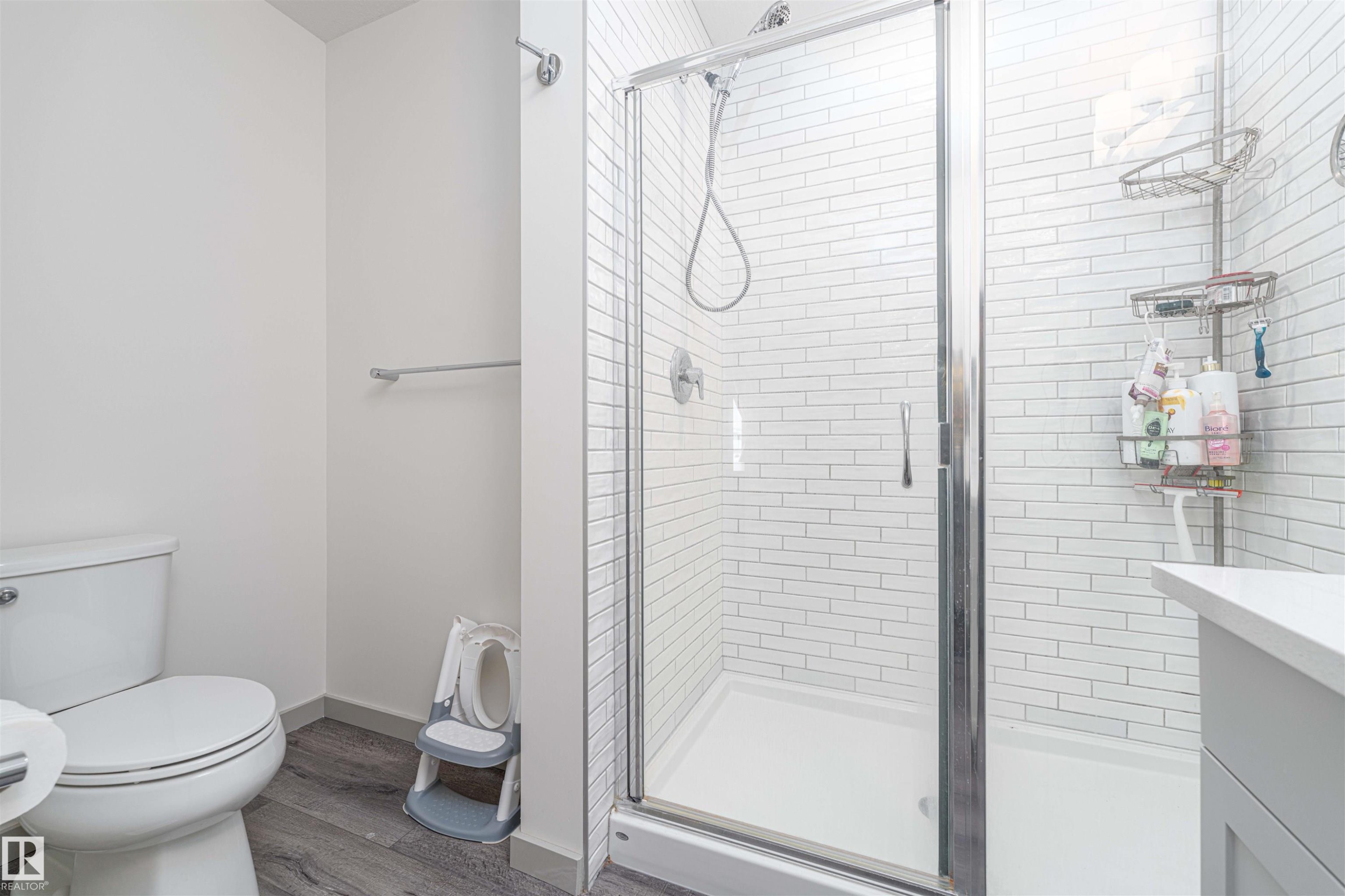 Bathroom featuring a shower stall, dark wood-type flooring, and vanity - 2330 Kelly Circle, Edmonton, AB - Indoor Photo Showing Bathroom