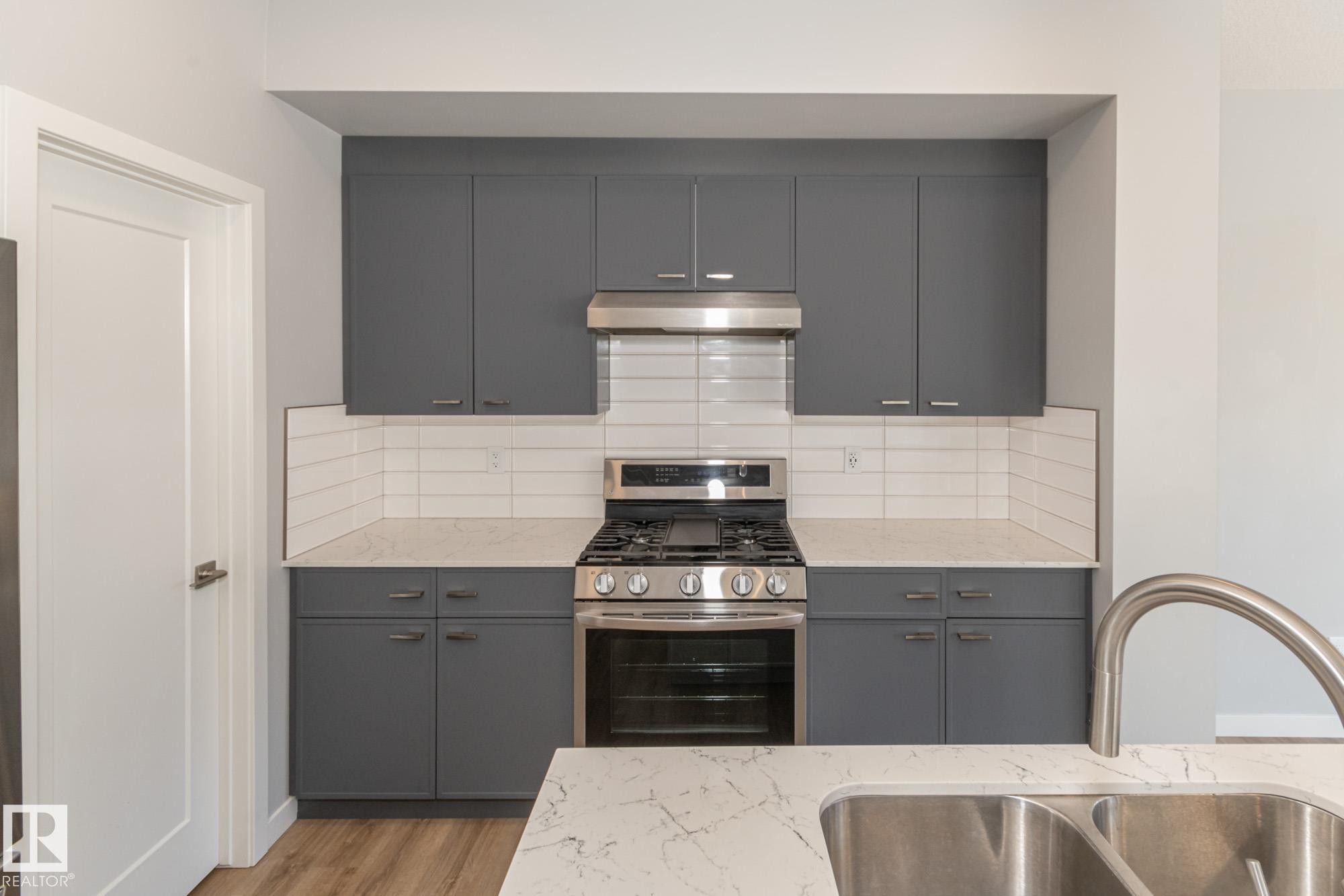 103 Garneau Gate, Spruce Grove, AB - Indoor Photo Showing Kitchen With Double Sink