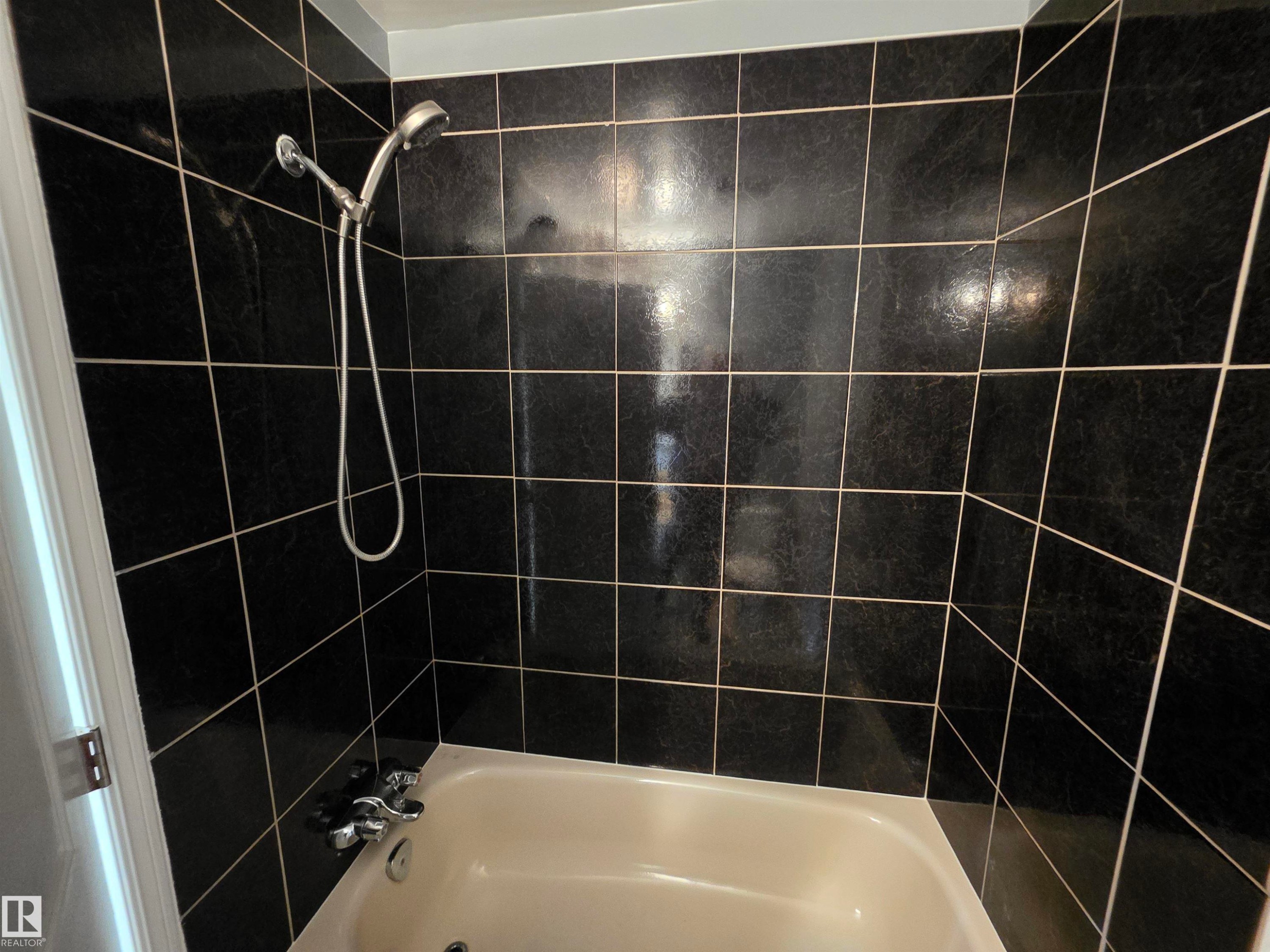 Bathroom featuring shower / bath combination - Edmonton, AB - Indoor Photo Showing Bathroom