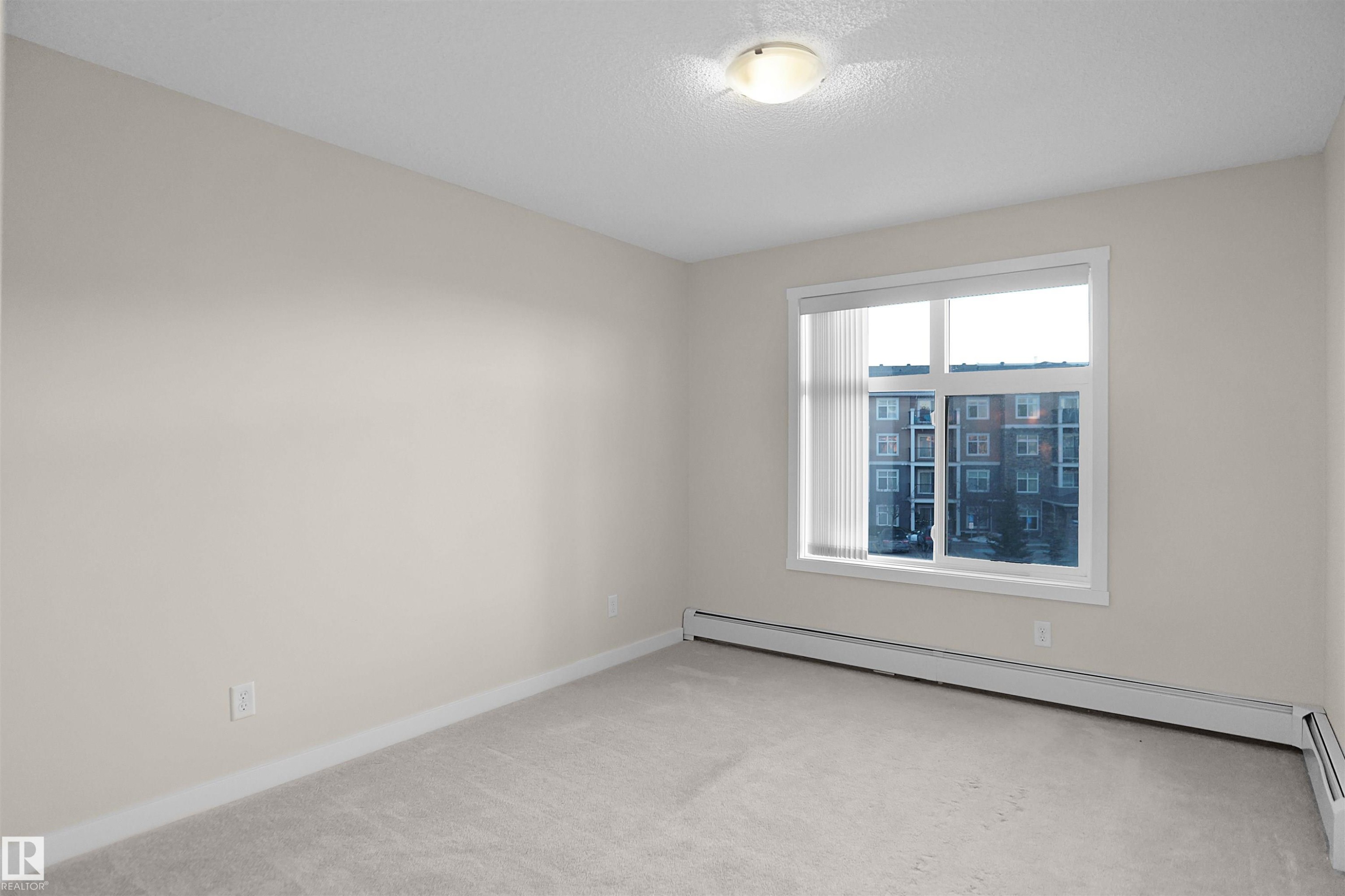 335 6076 Schonsee Way, Edmonton, AB - Indoor Photo Showing Other Room