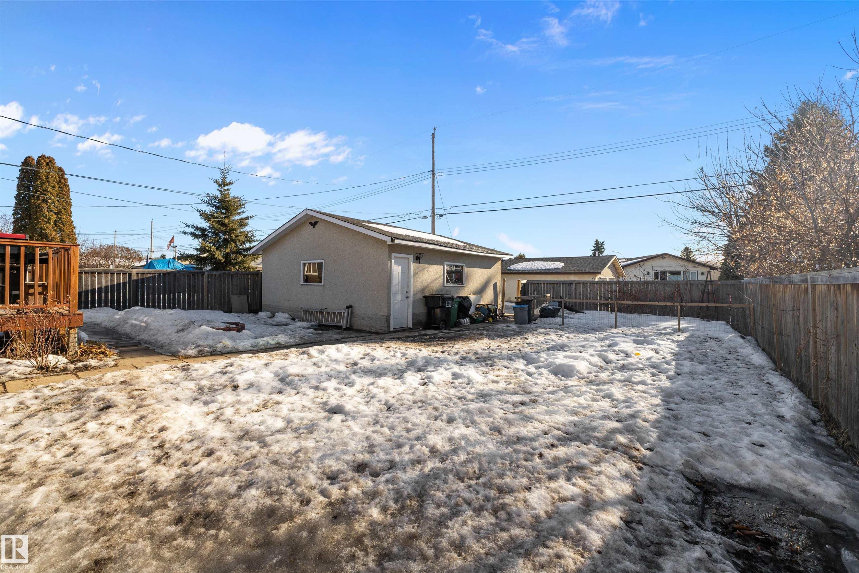 Back of property with stucco siding and a fenced backyard - 5703 143 Avenue, Edmonton, AB - Outdoor