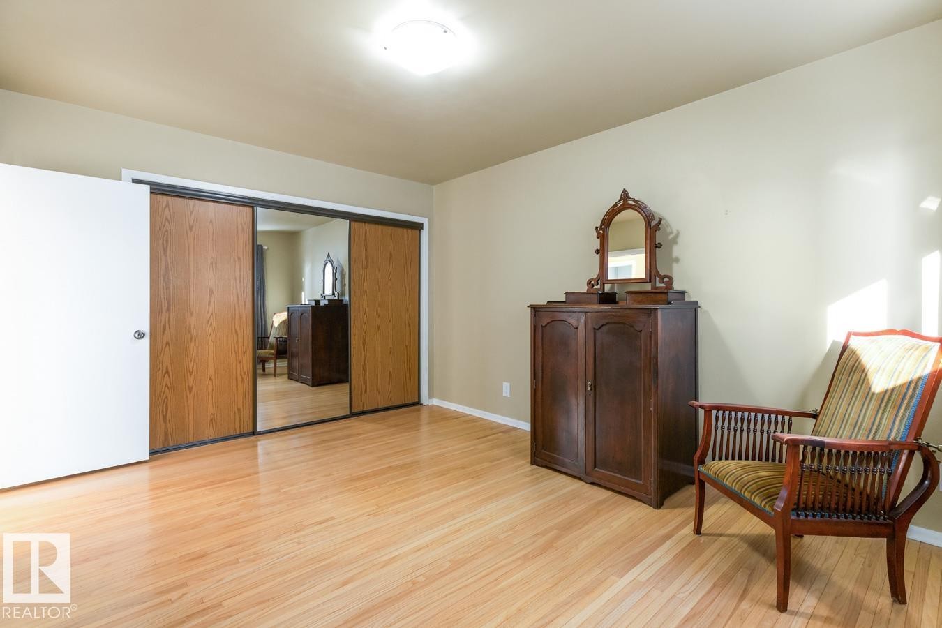 Large Primary Bedroom with an impressive amount of Closet Space including built ins. - 8707 Strathearn Drive, Edmonton, AB - Indoor