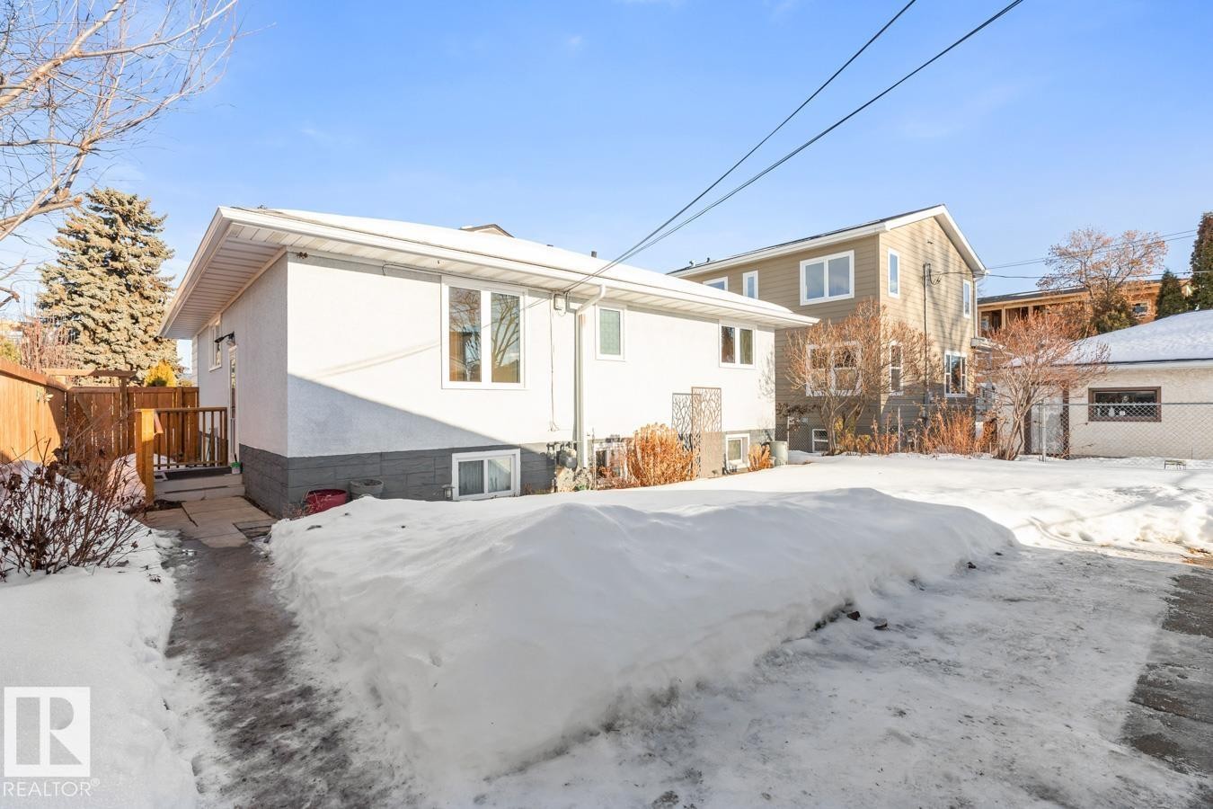 Exterior Back of House with view of great sized fully fenced yard and separate side entrance. - 8707 Strathearn Drive, Edmonton, AB - Outdoor
