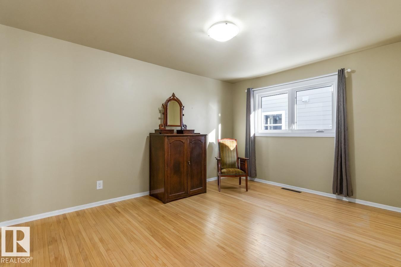 Large Primary Bedroom with an impressive amount of Closet Space including built ins. - 8707 Strathearn Drive, Edmonton, AB - Indoor Photo Showing Other Room