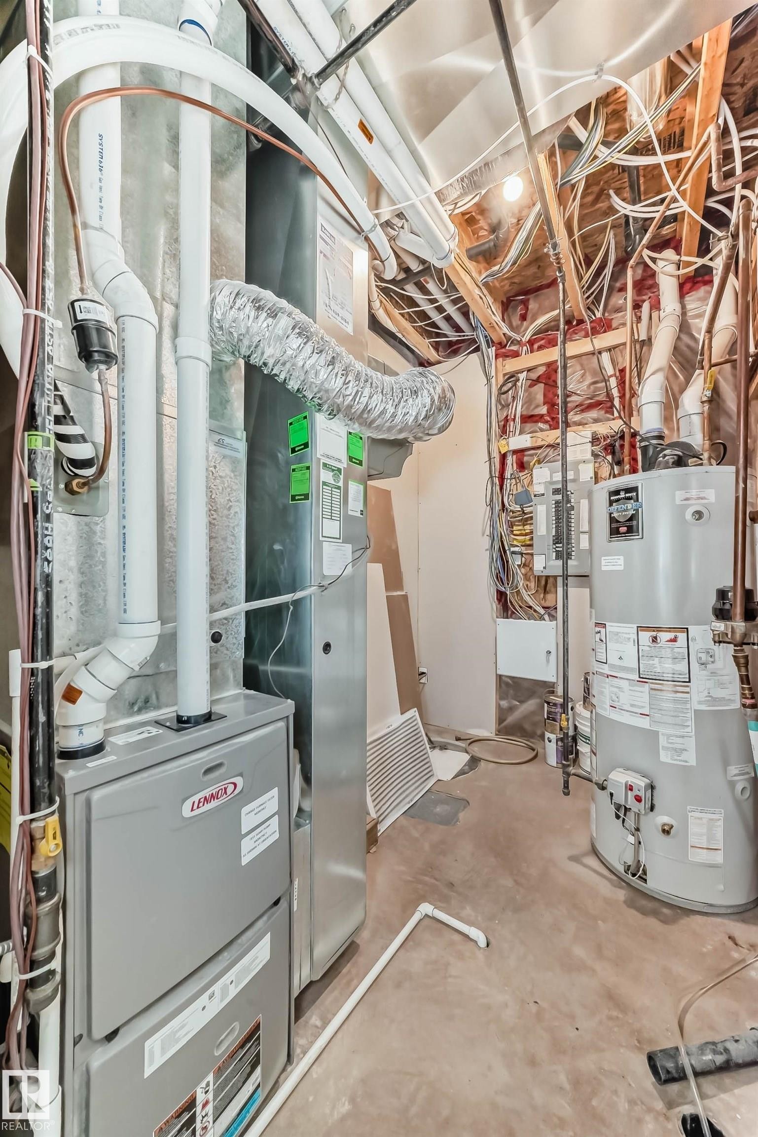 Utility room featuring gas water heater and heating unit - 7719 Getty Wynd, Edmonton, AB - Indoor Photo Showing Basement