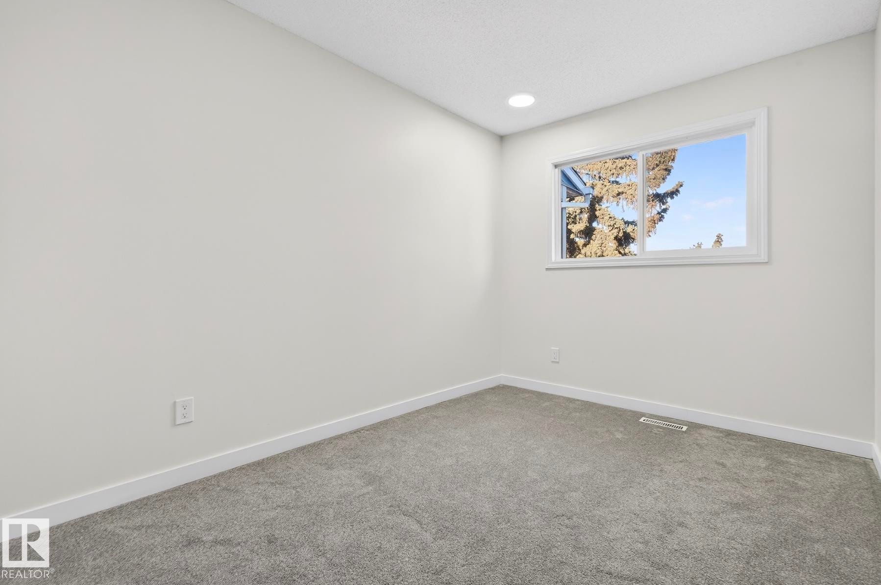 Carpeted empty room with baseboards and recessed lighting - 9969 171 Ave, Edmonton, AB - Indoor Photo Showing Other Room