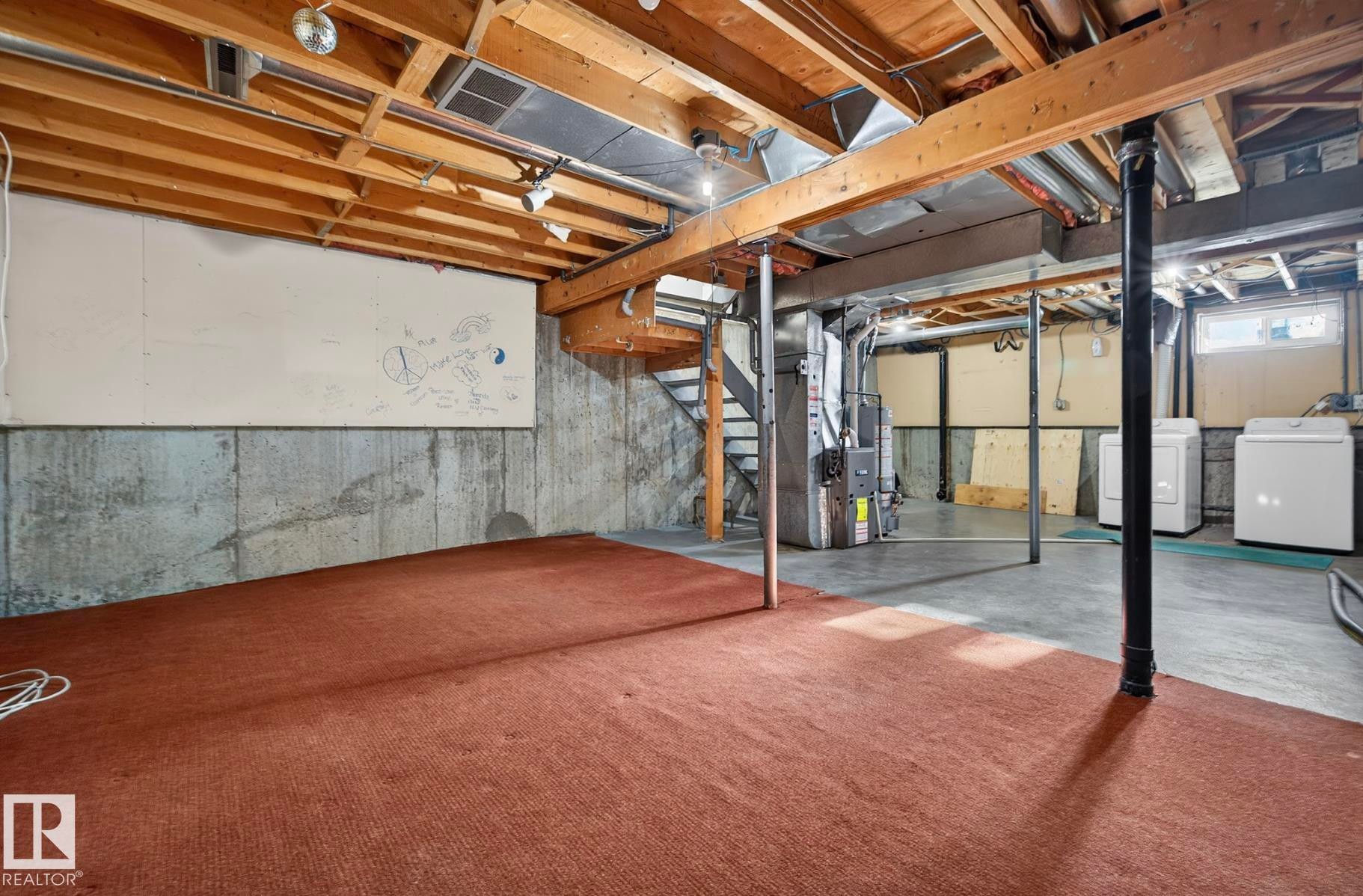 Below grade area featuring washer / clothes dryer, heating unit, and water heater - 9969 171 Ave, Edmonton, AB - Indoor Photo Showing Basement