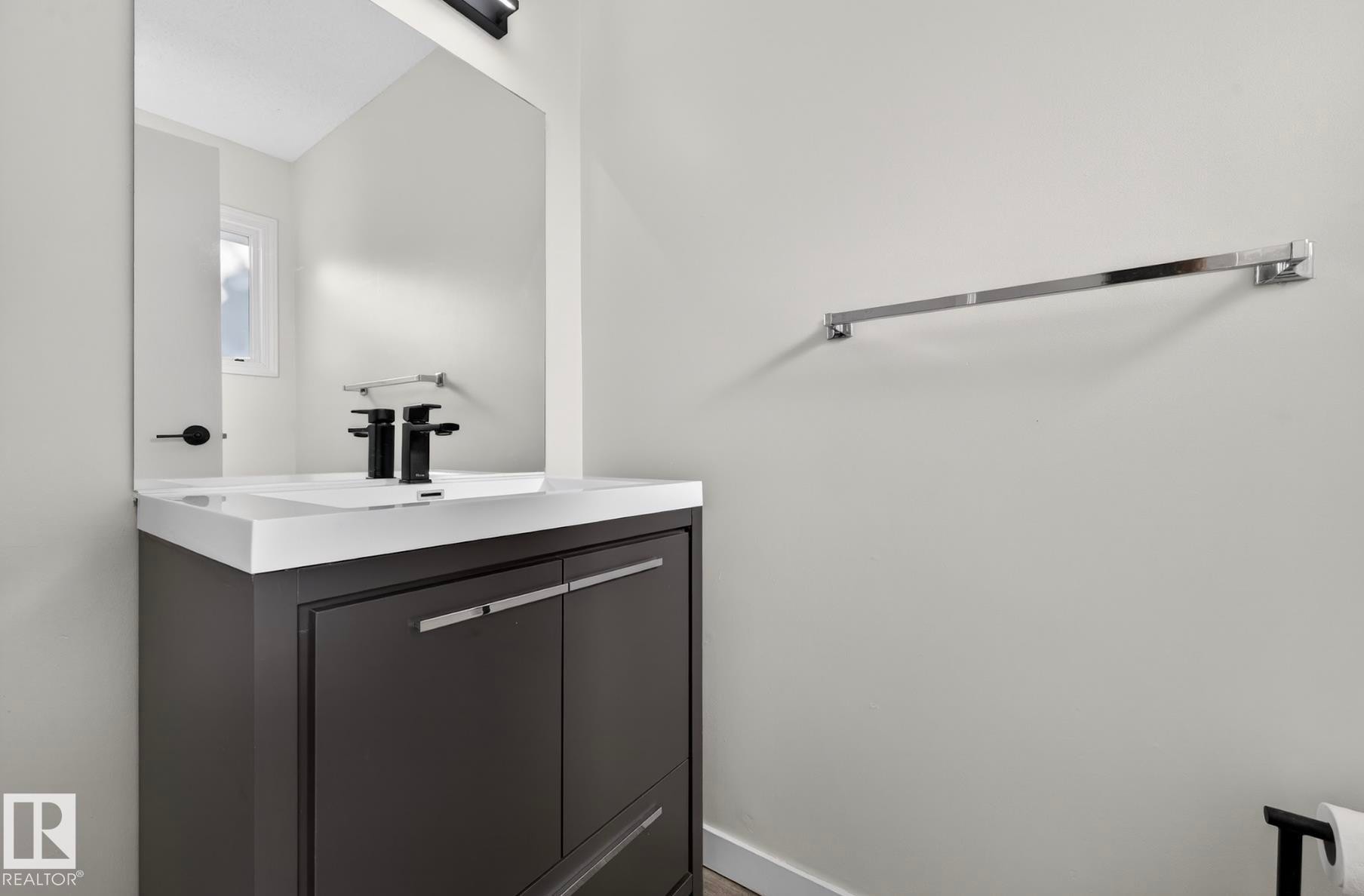 Bathroom with vanity and baseboards - 9969 171 Ave, Edmonton, AB - Indoor Photo Showing Bathroom