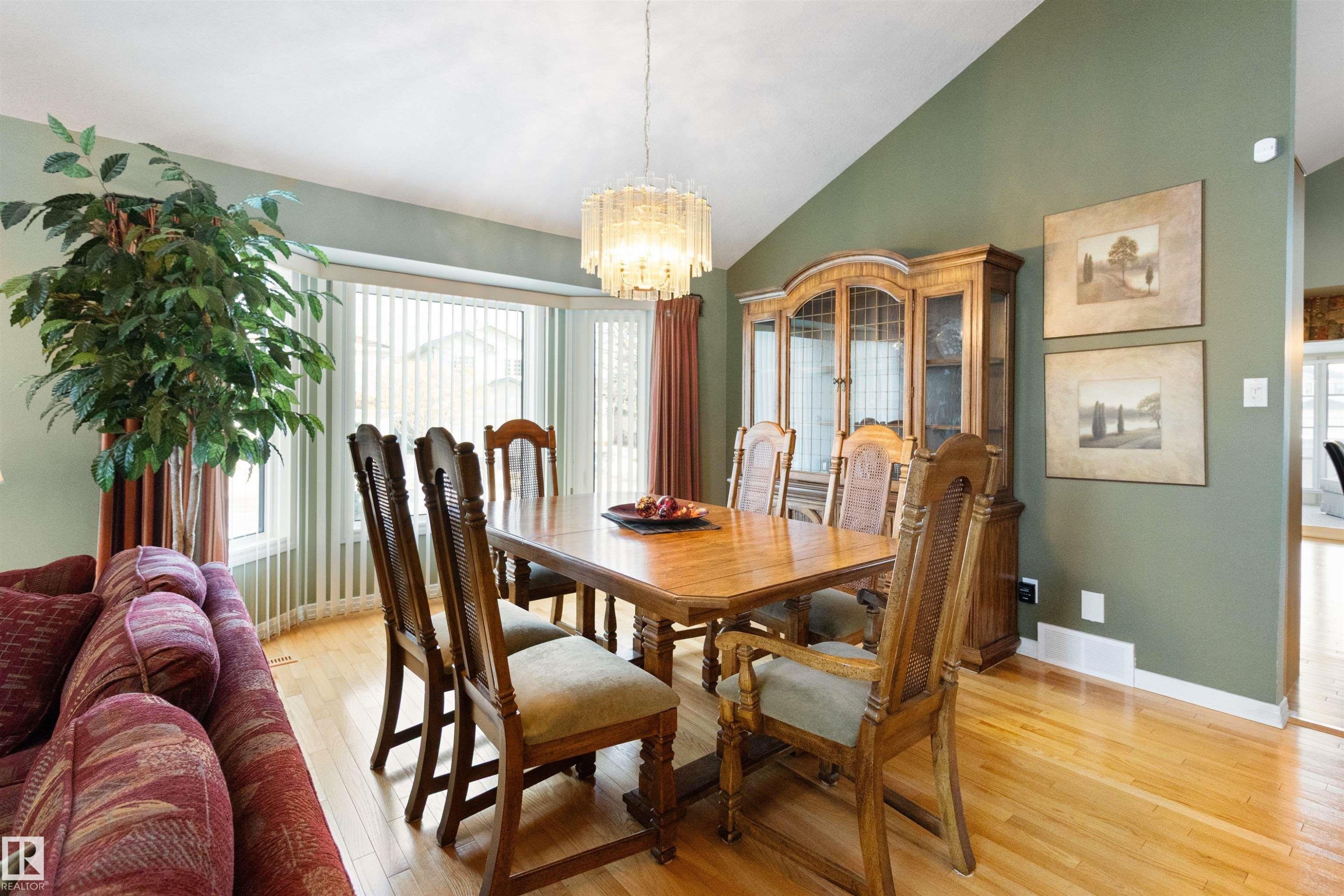 Dining area featuring vaulted ceiling, light wood-type flooring, and hanging lights - 519 Buchanan Road, Edmonton, AB - Indoor Photo Showing Dining Room