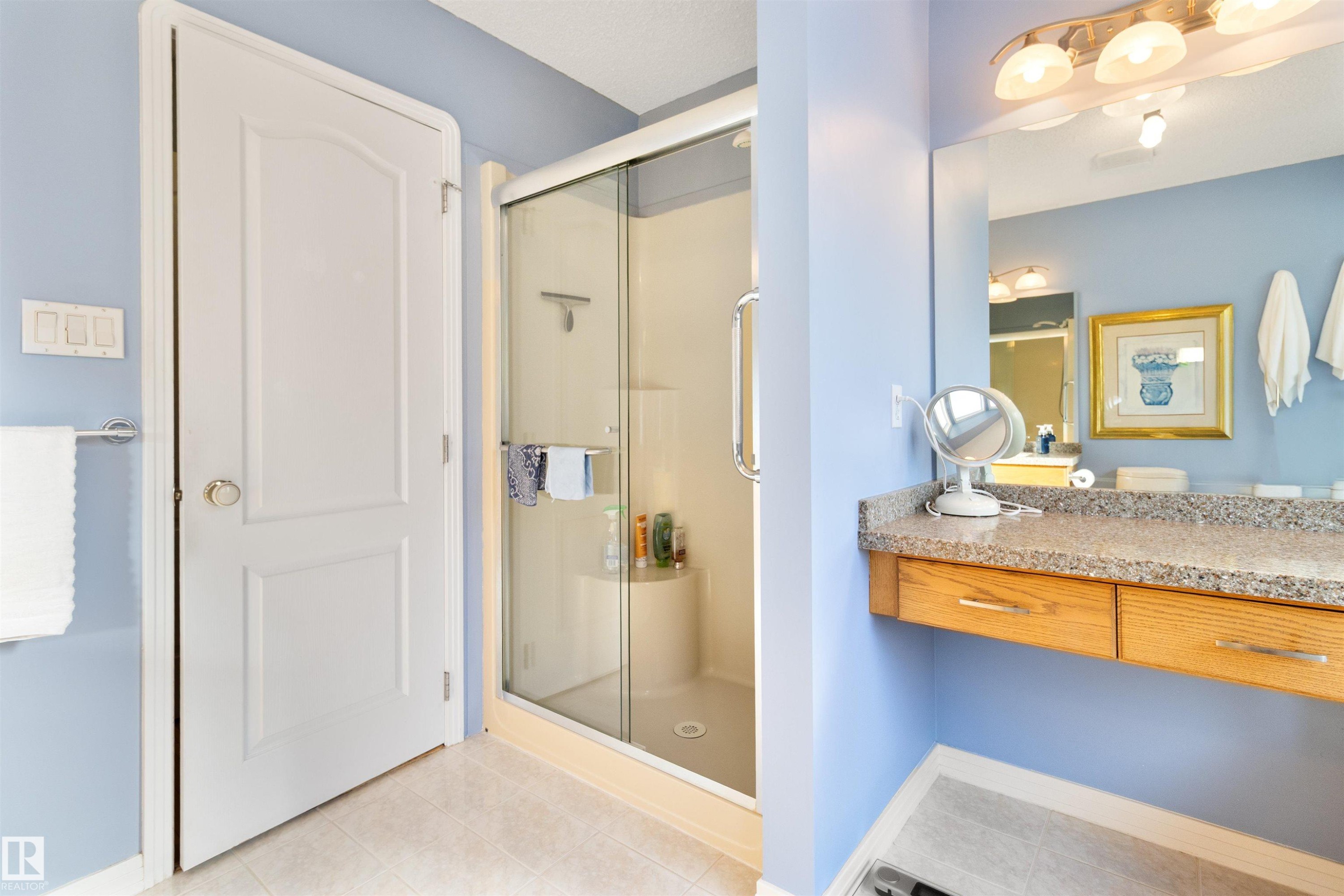 Full bathroom featuring a stall shower, vanity, and light tile patterned floors - 519 Buchanan Road, Edmonton, AB - Indoor Photo Showing Other Room