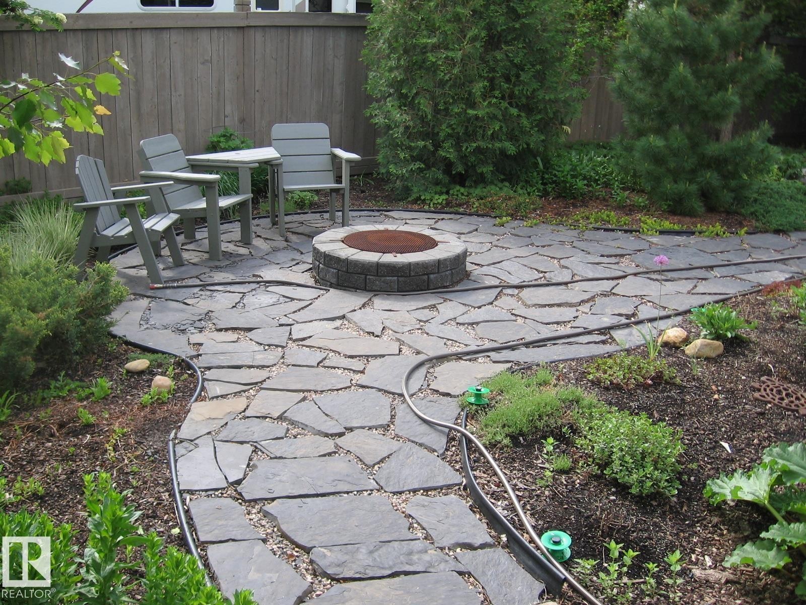 View of patio / terrace featuring a fire pit - 519 Buchanan Road, Edmonton, AB - Outdoor With Deck Patio Veranda