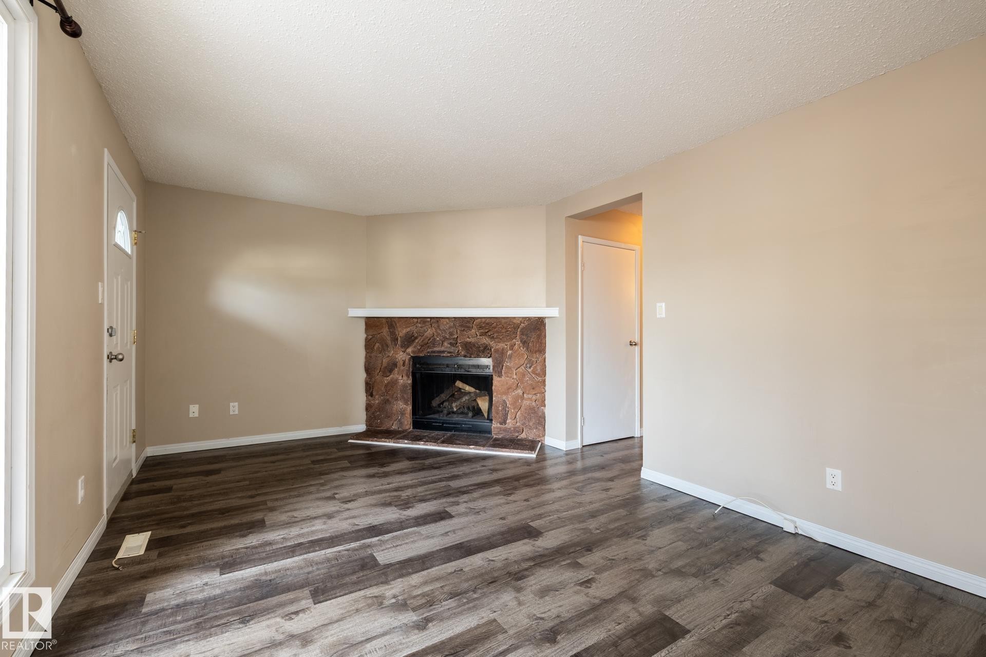 Edmonton, AB - Indoor Photo Showing Living Room With Fireplace