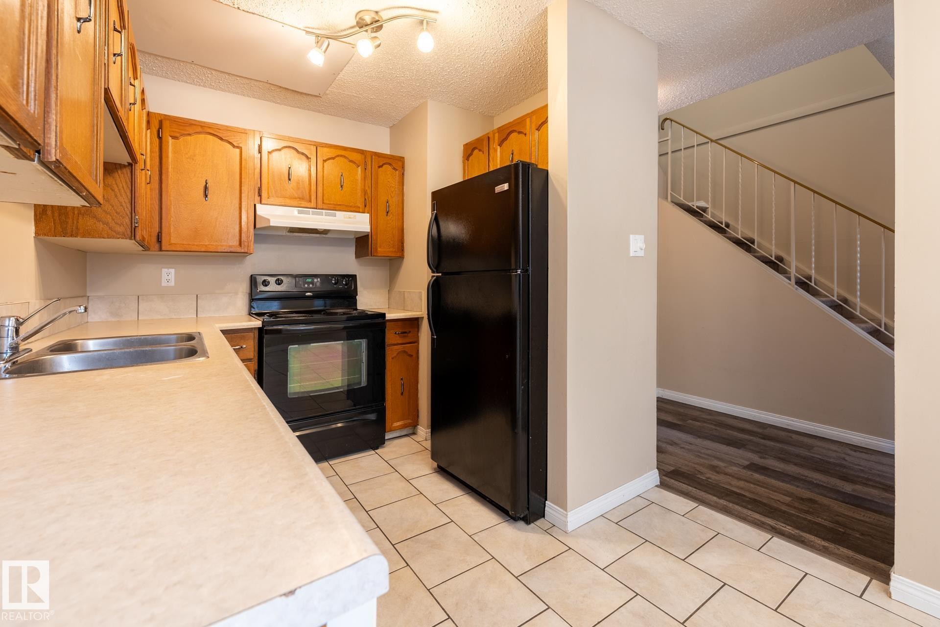 Edmonton, AB - Indoor Photo Showing Kitchen With Double Sink