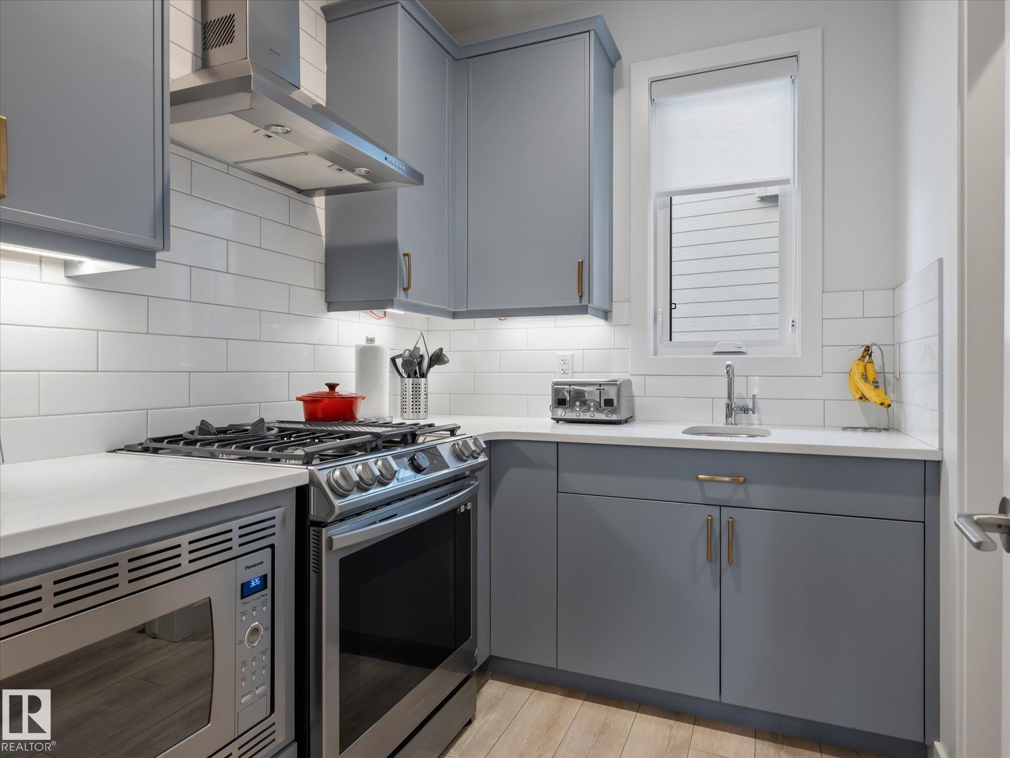 The Butler's Pantry includes another gas stove, microwave and large pantry area. - 1562 Howes Place, Edmonton, AB - Indoor Photo Showing Kitchen With Upgraded Kitchen