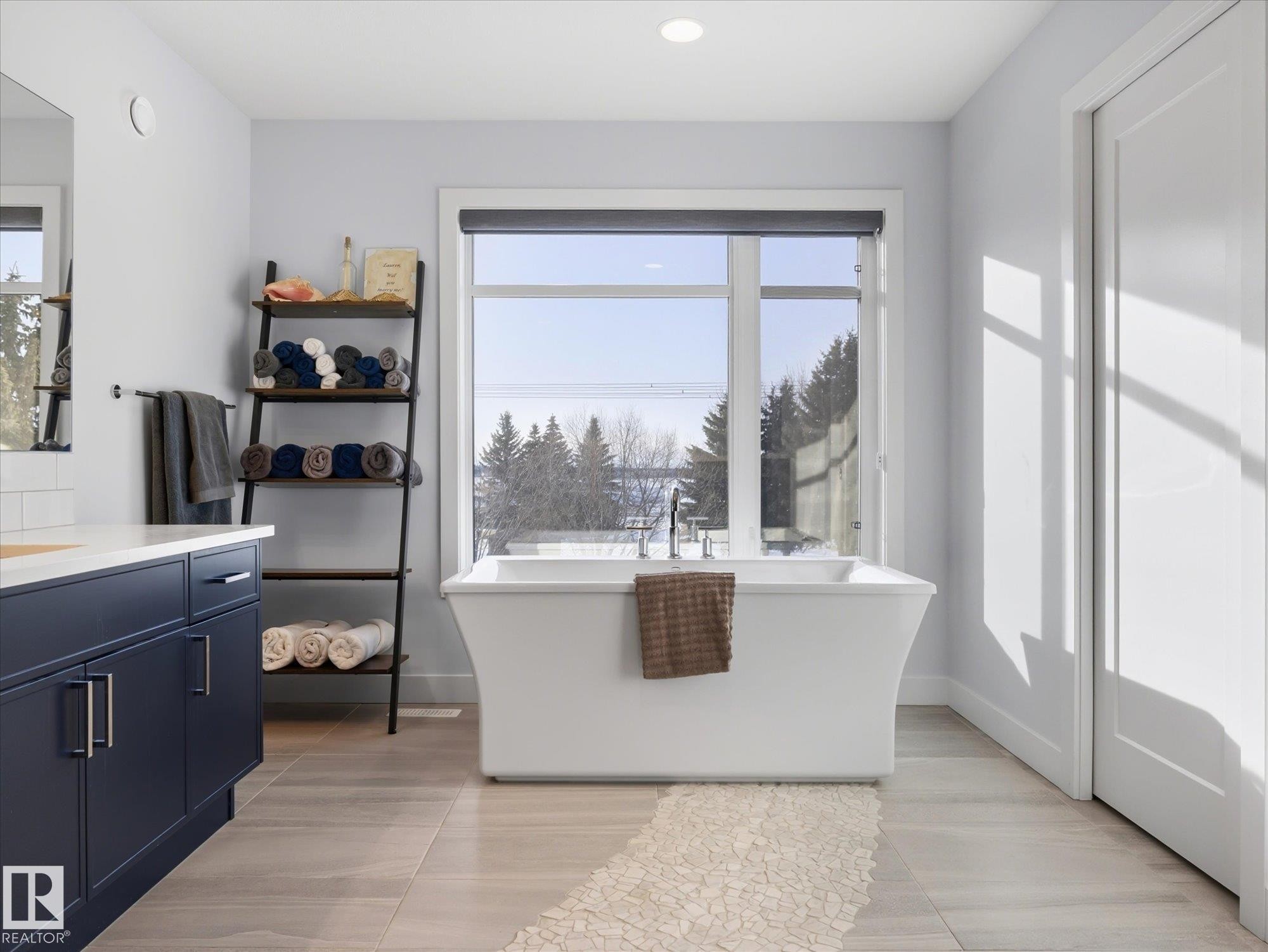 This elegant free standing tub with views of the golf course encourages relaxation, privacy glass ensures your view remains unrestricted. - 1562 Howes Place, Edmonton, AB - Indoor
