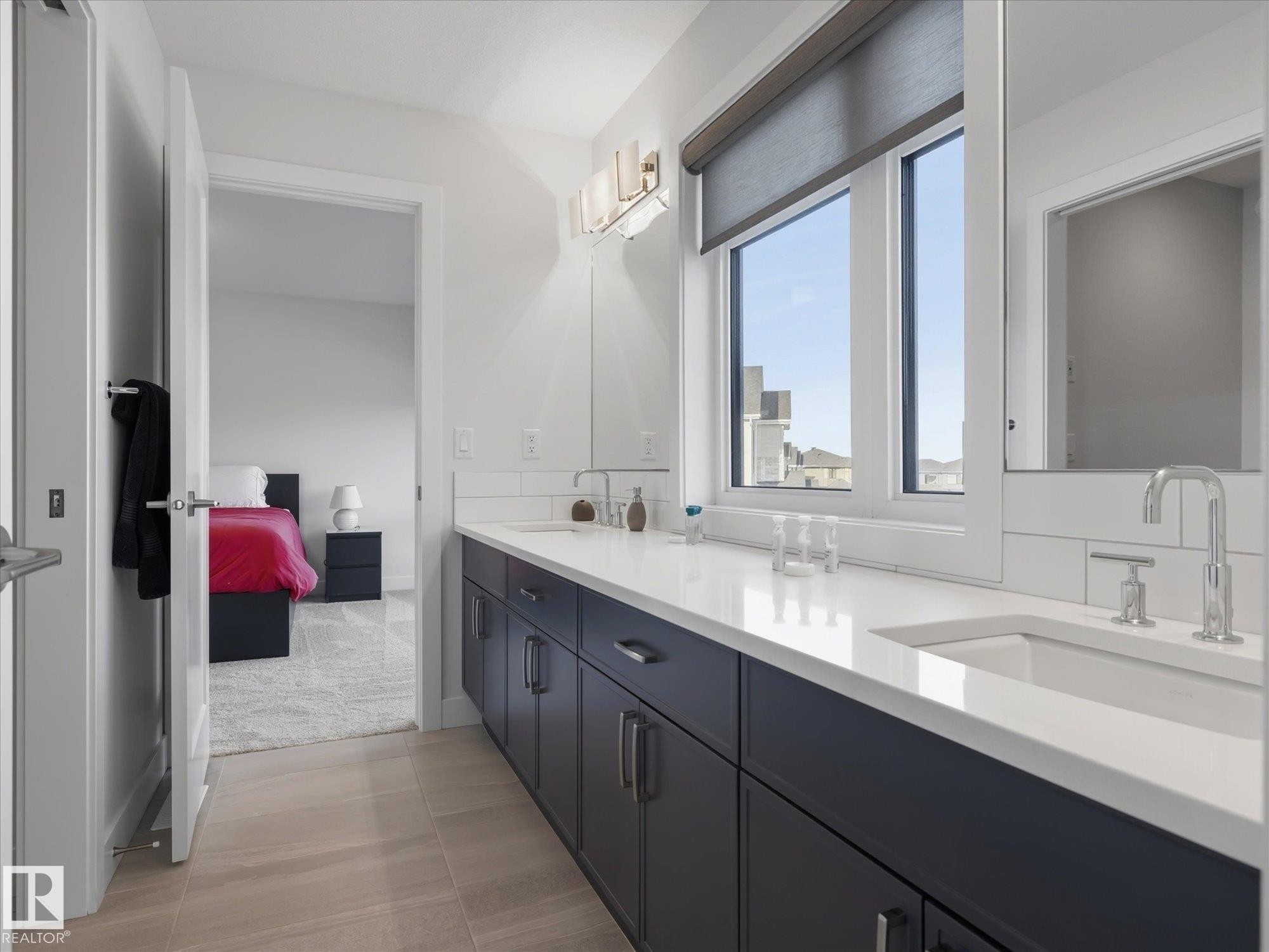 Shared ensuite between two upper bedrooms with private water closet and shower area. - 1562 Howes Place, Edmonton, AB - Indoor Photo Showing Bathroom