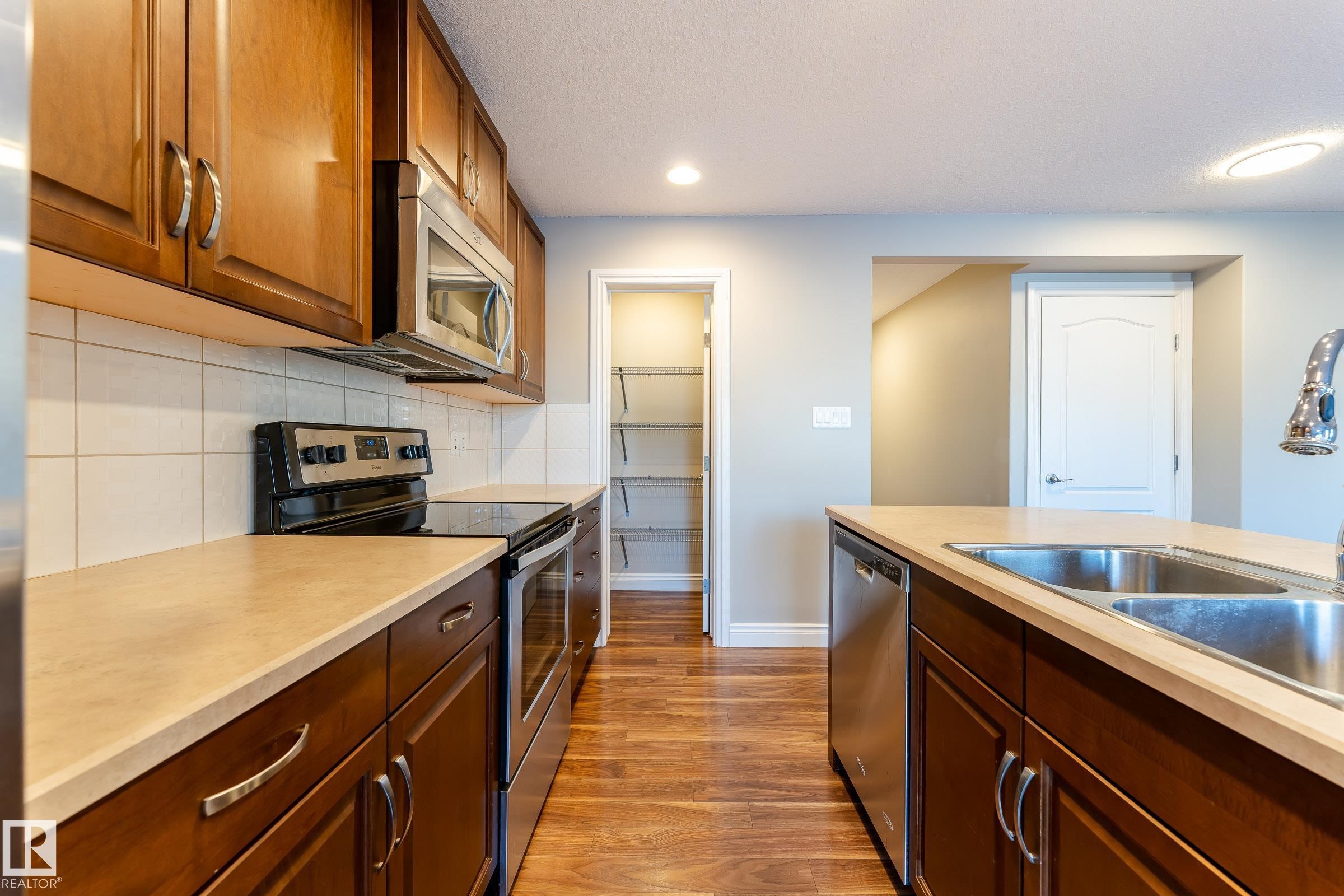 17614 8 Avenue, Edmonton, AB - Indoor Photo Showing Kitchen With Double Sink