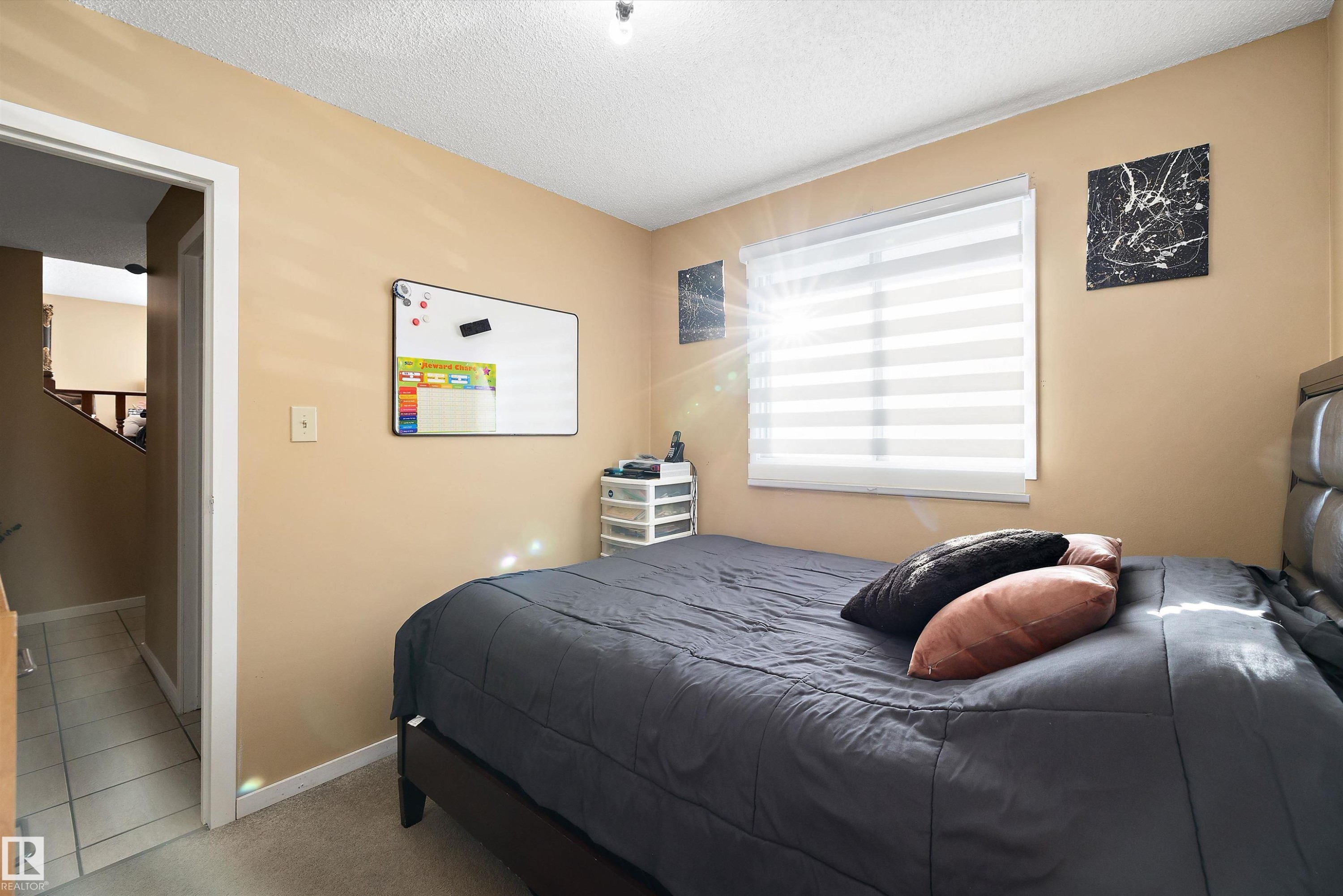 Bedroom featuring a textured ceiling and carpet - 9804 156 Avenue, Edmonton, AB - Indoor Photo Showing Bedroom