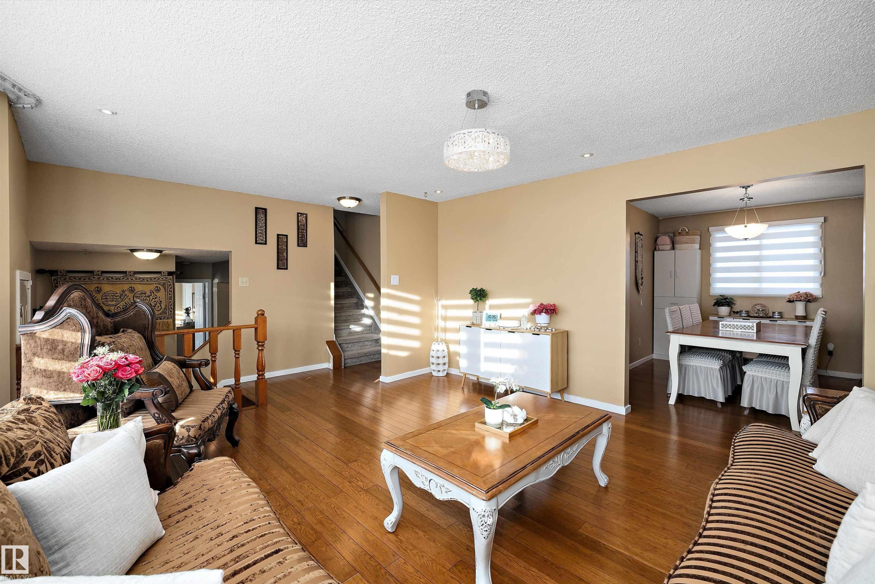 Living area with hardwood / wood-style flooring and a textured ceiling - 9804 156 Avenue, Edmonton, AB - Indoor Photo Showing Living Room