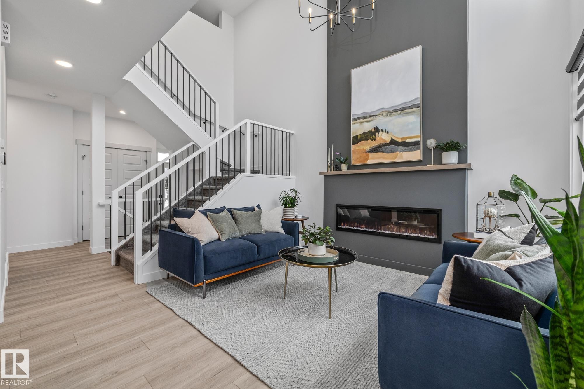 664 Astoria Way, Devon, AB - Indoor Photo Showing Living Room With Fireplace