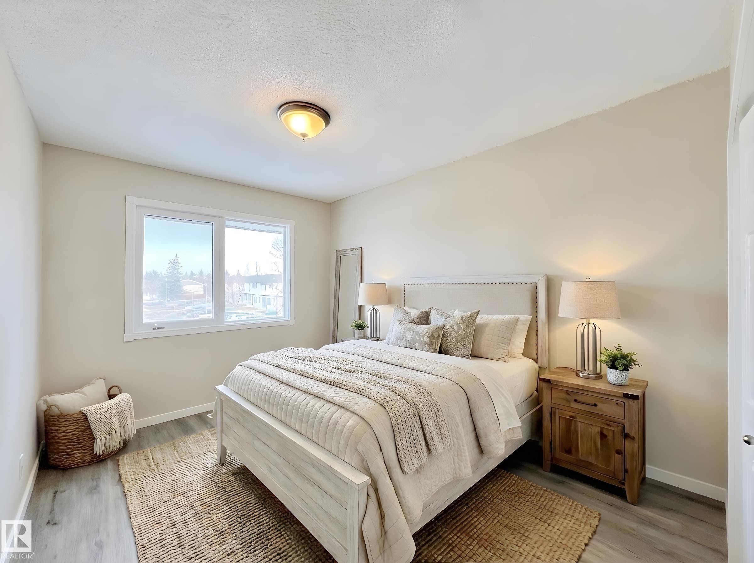 Bedroom featuring light wood-type flooring - 11357 22 Avenue, Edmonton, AB - Indoor Photo Showing Bedroom