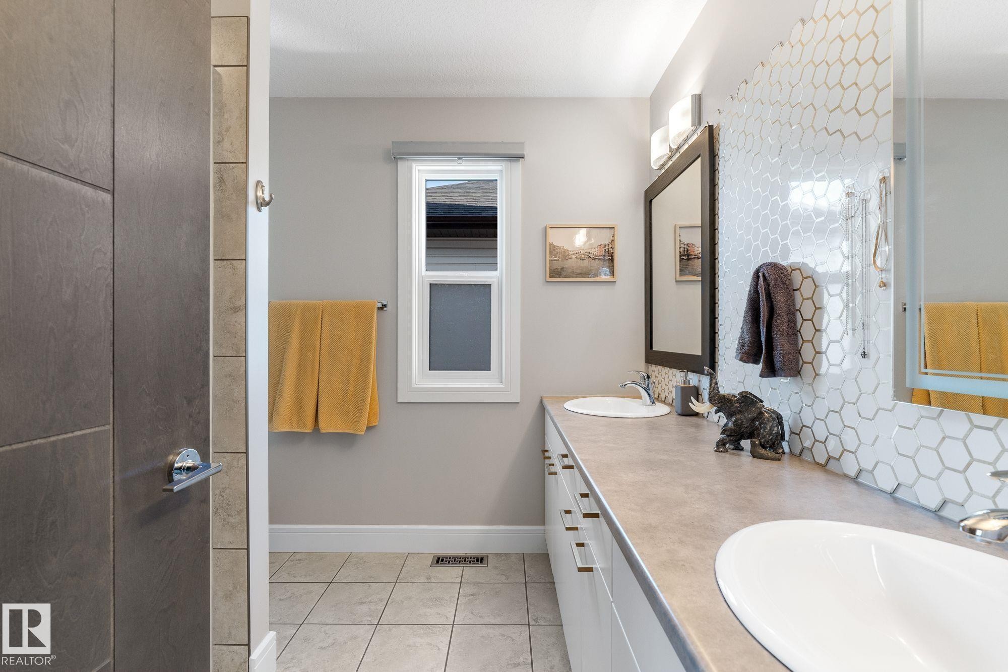 Featuring dual sink vanity and walk in shower - 89 Hewitt Circle, Spruce Grove, AB - Indoor Photo Showing Bathroom