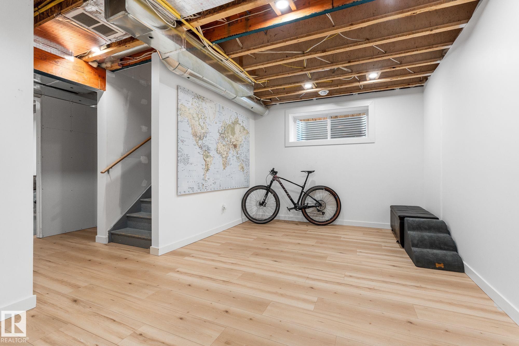 Partially finished Basement with light wood finished floors - 89 Hewitt Circle, Spruce Grove, AB - Indoor Photo Showing Basement