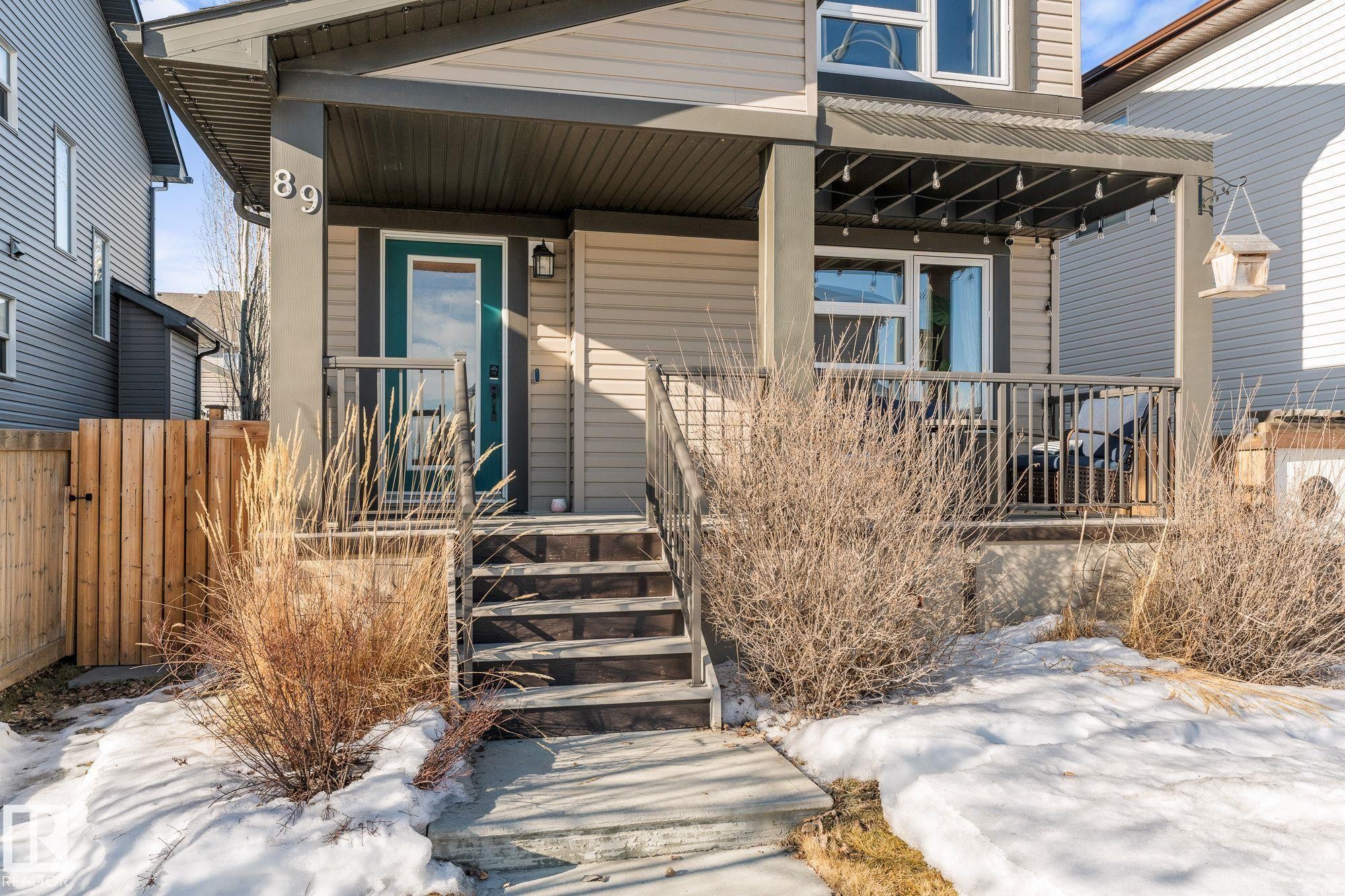 Landscaped yard and path to the front deck - 89 Hewitt Circle, Spruce Grove, AB - Outdoor With Deck Patio Veranda
