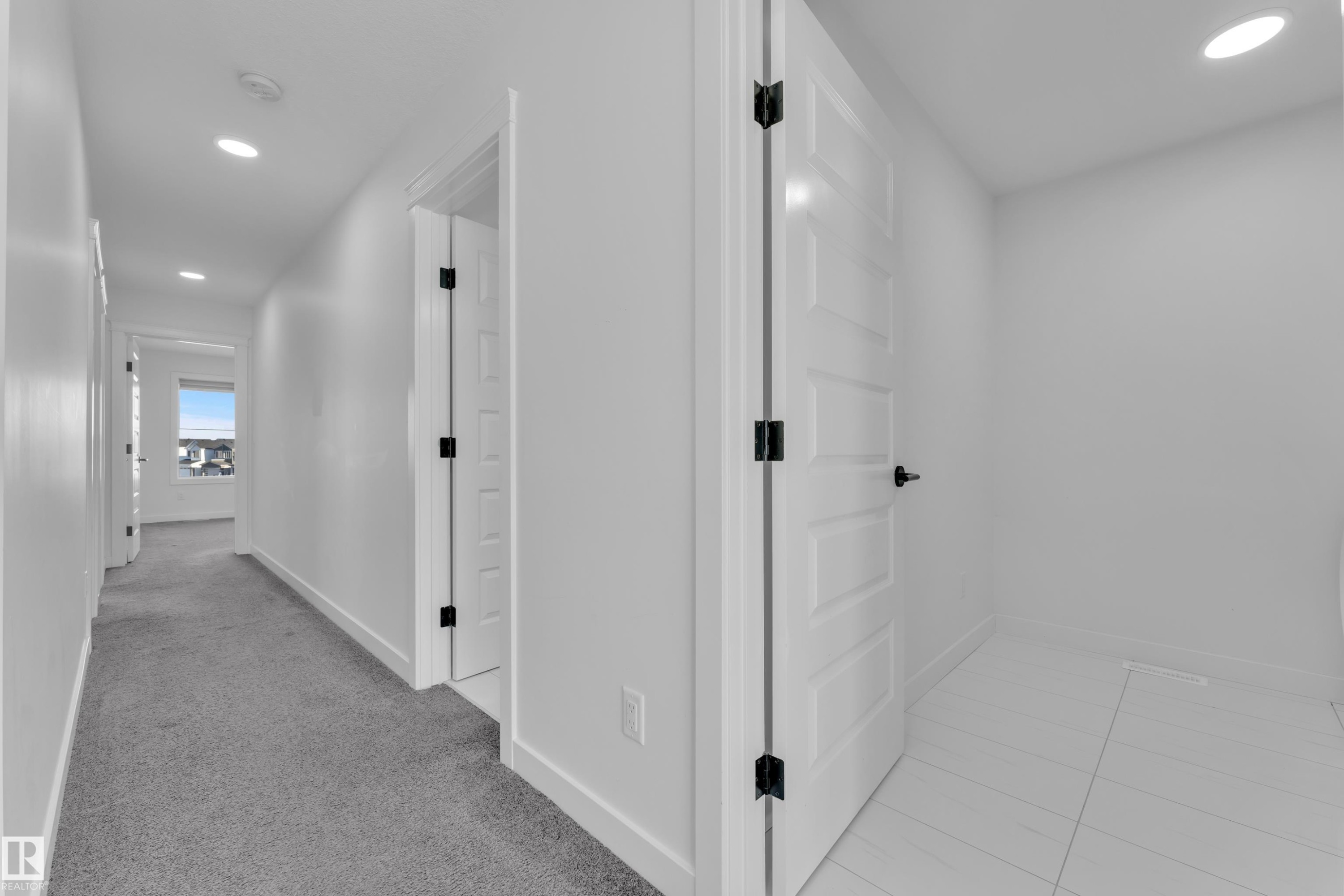 Hall featuring recessed lighting and light colored carpet - 1822 Collip View, Edmonton, AB