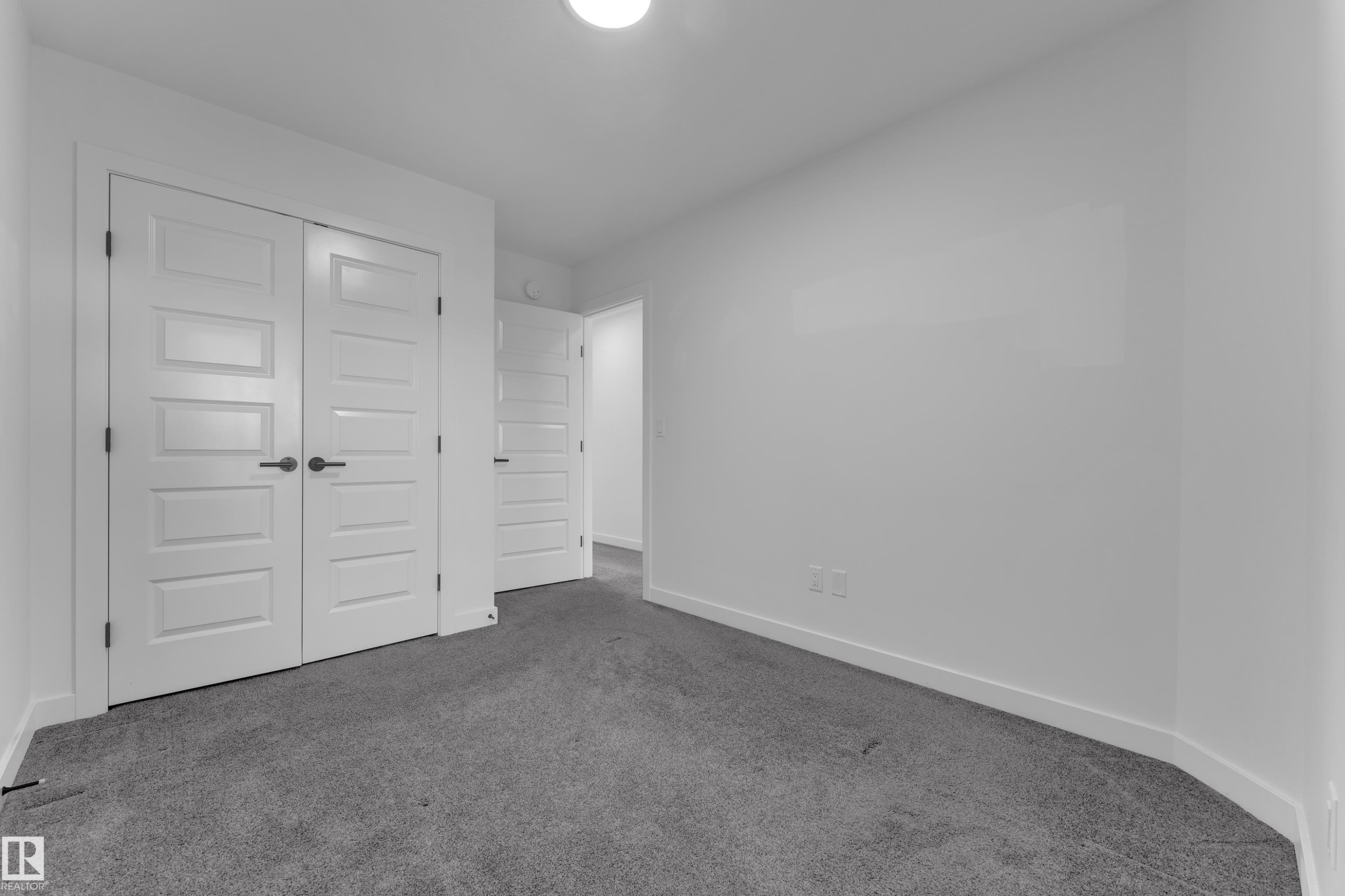 Unfurnished bedroom featuring carpet and a closet - 1822 Collip View, Edmonton, AB