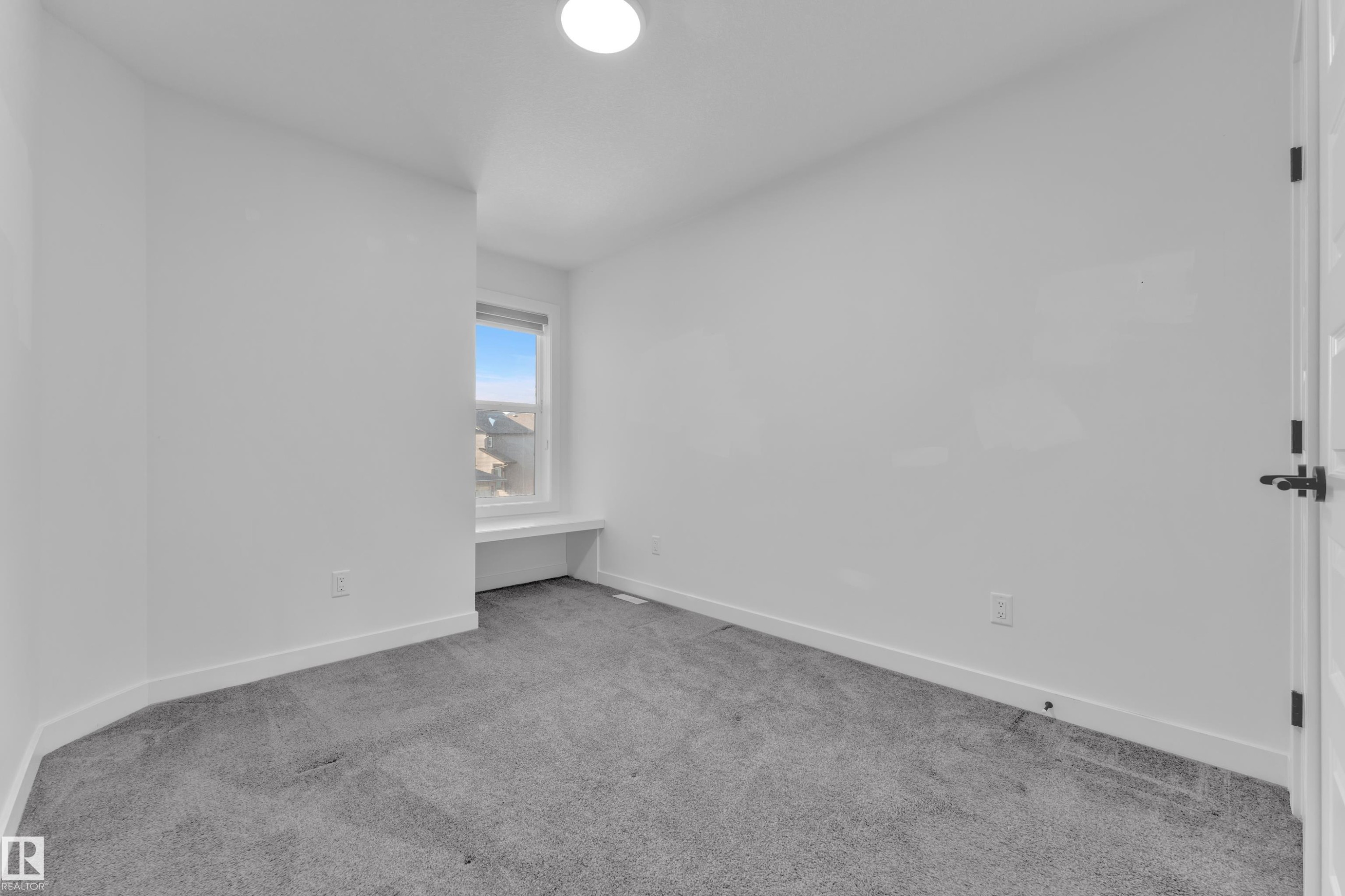 Unfurnished bedroom featuring light colored carpet and baseboards - 1822 Collip View, Edmonton, AB