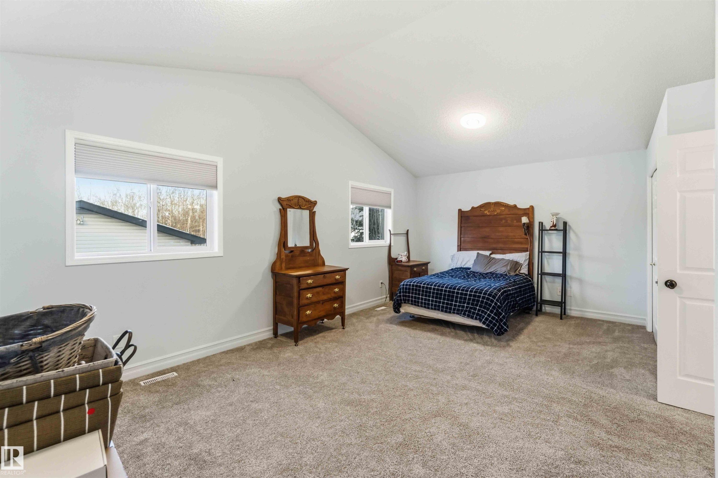 Bedroom featuring light colored carpet - 1706 Turvey Bend, Edmonton, AB - Indoor Photo Showing Bedroom