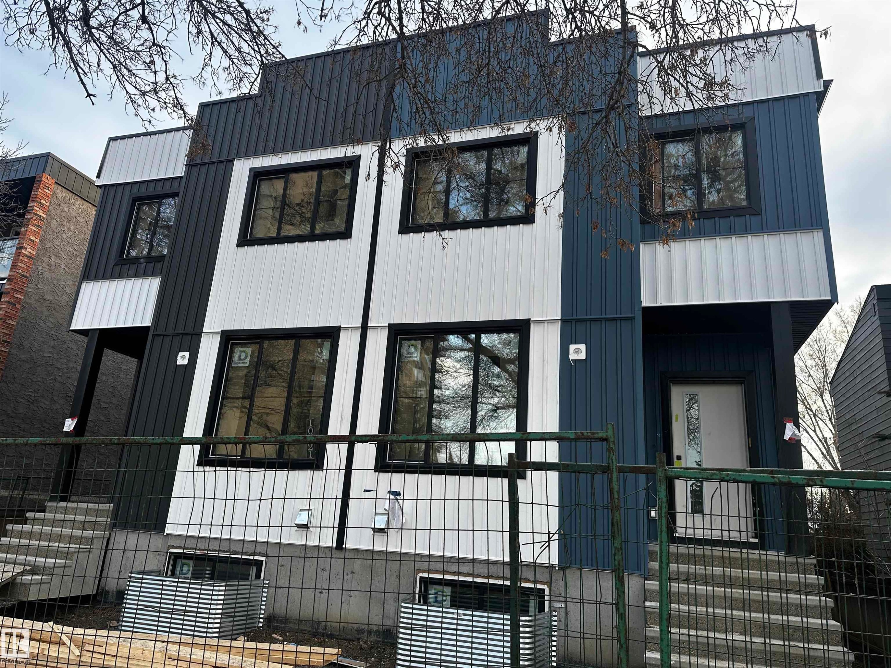 View of property exterior with a metal roof - 10021 89 Avenue, Edmonton, AB - Outdoor