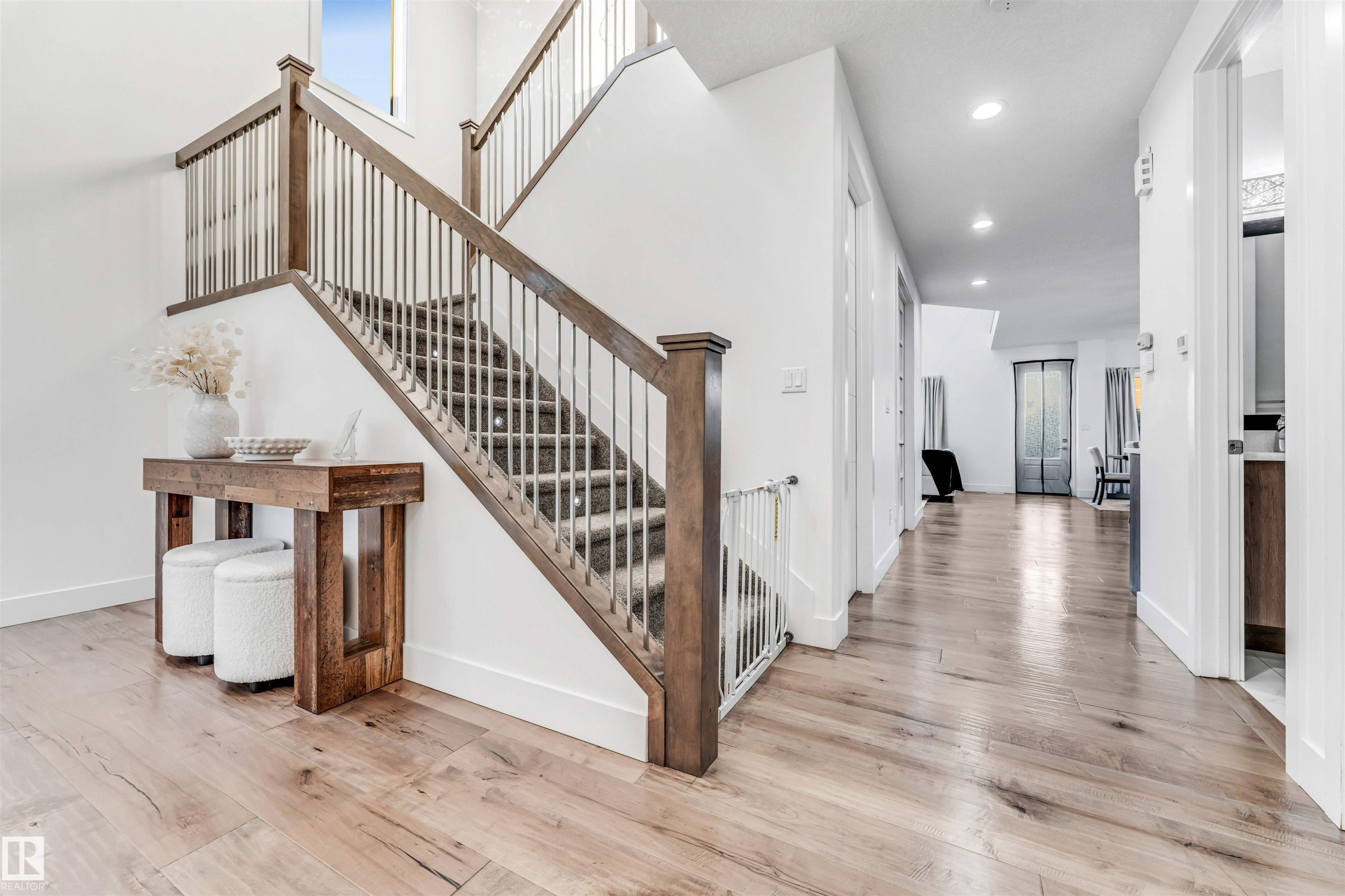 Stairs with hardwood / wood-style flooring, recessed lighting, and a high ceiling - 1407 Graydon Hill Way, Edmonton, AB - Indoor Photo Showing Other Room