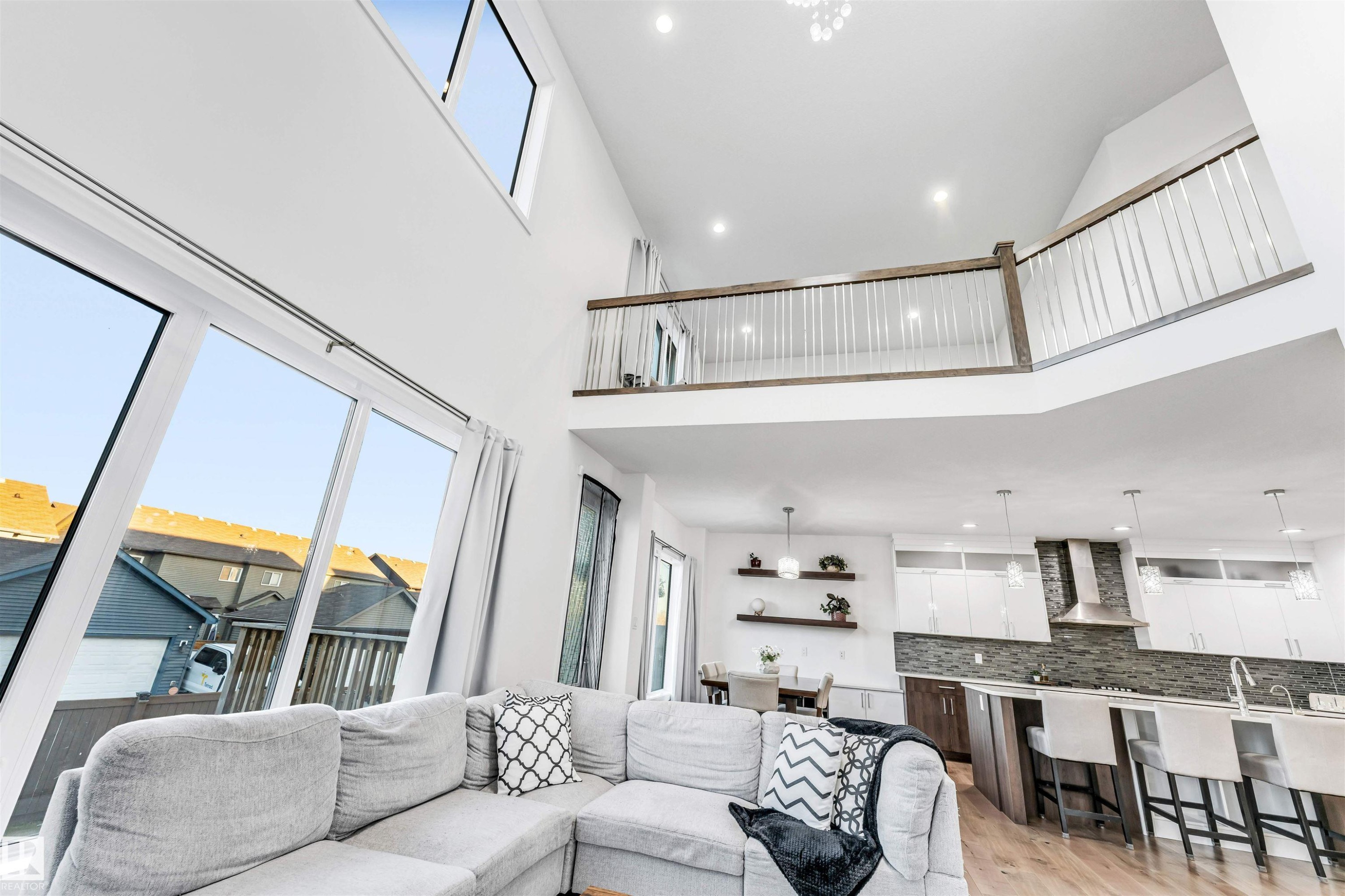 Living area featuring recessed lighting, a high ceiling, and light wood-style flooring - 1407 Graydon Hill Way, Edmonton, AB - Indoor Photo Showing Living Room