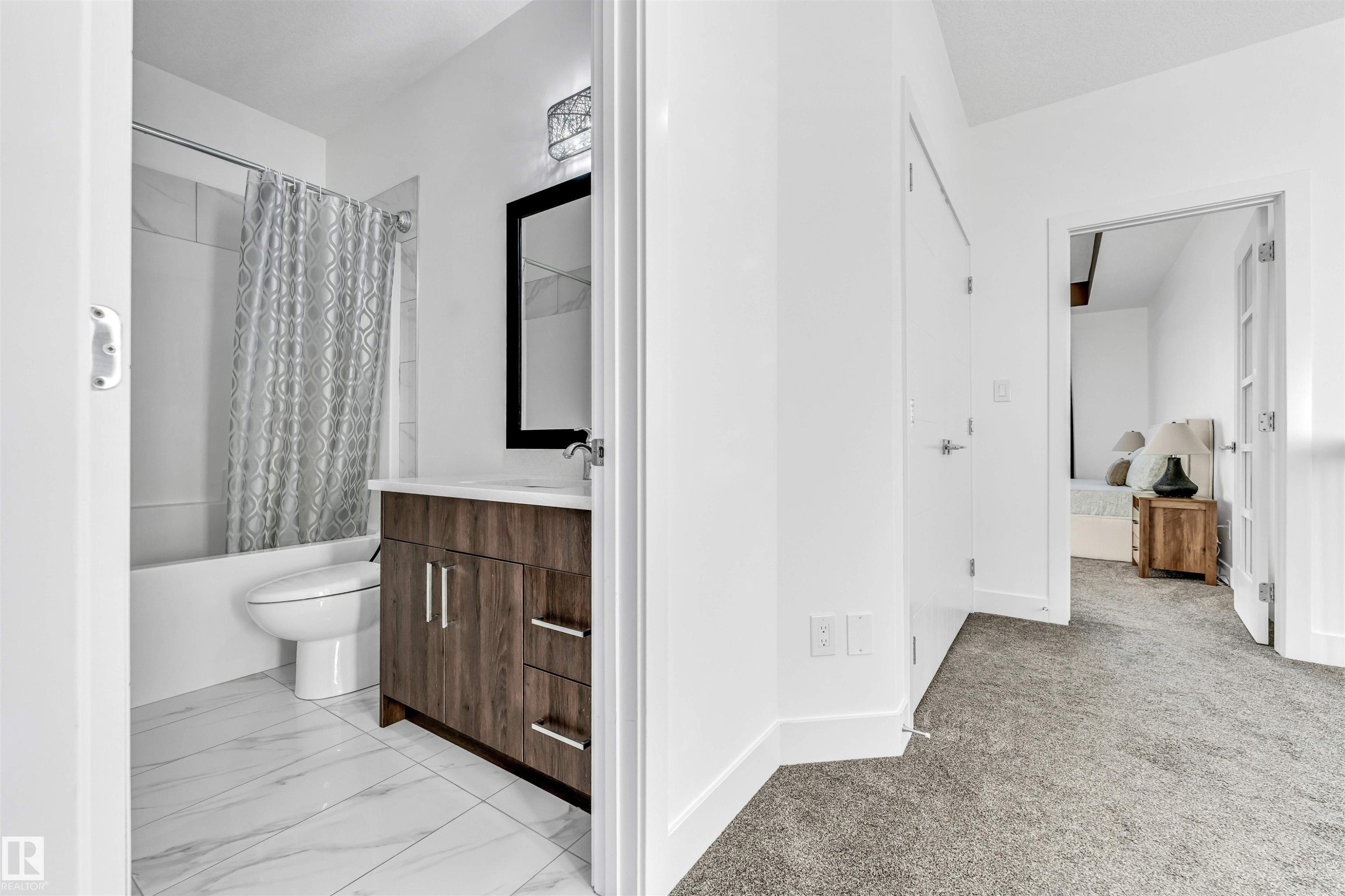 Bathroom with vanity, shower / tub combo, and light carpet - 1407 Graydon Hill Way, Edmonton, AB - Indoor Photo Showing Bathroom