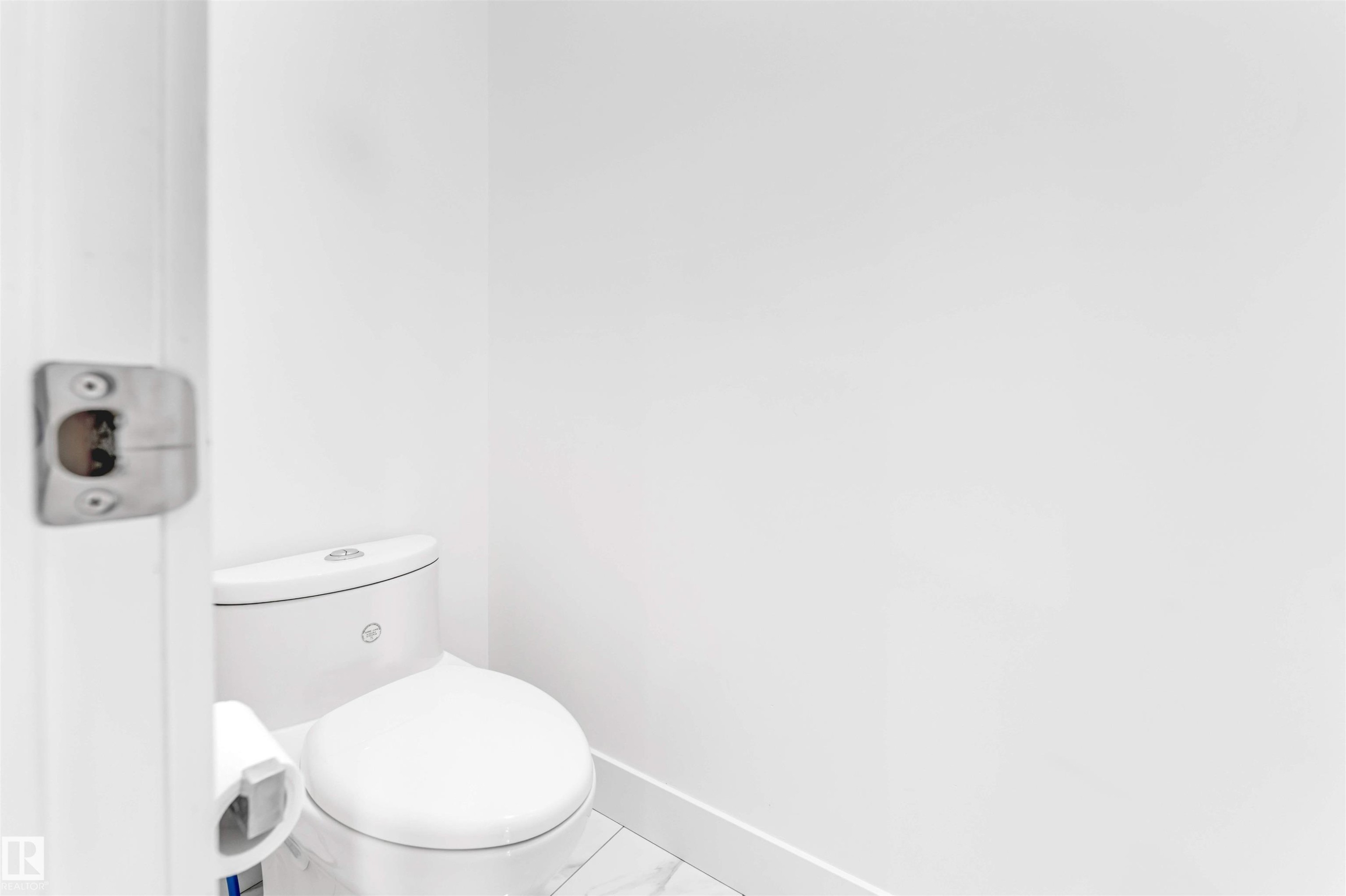 Bathroom with baseboards and marble look tiles - 1407 Graydon Hill Way, Edmonton, AB - Indoor Photo Showing Bathroom