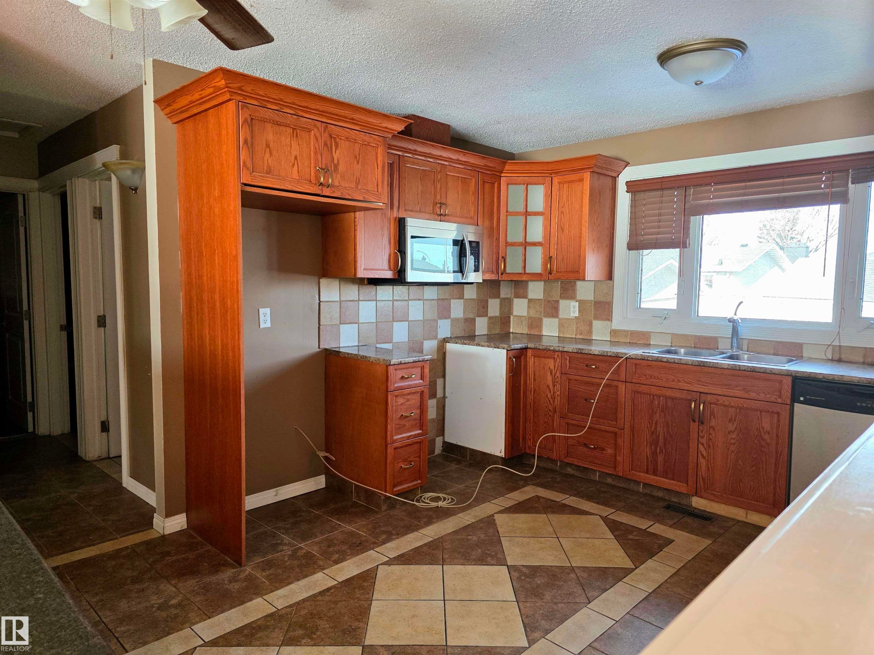 Edmonton, AB - Indoor Photo Showing Kitchen With Double Sink
