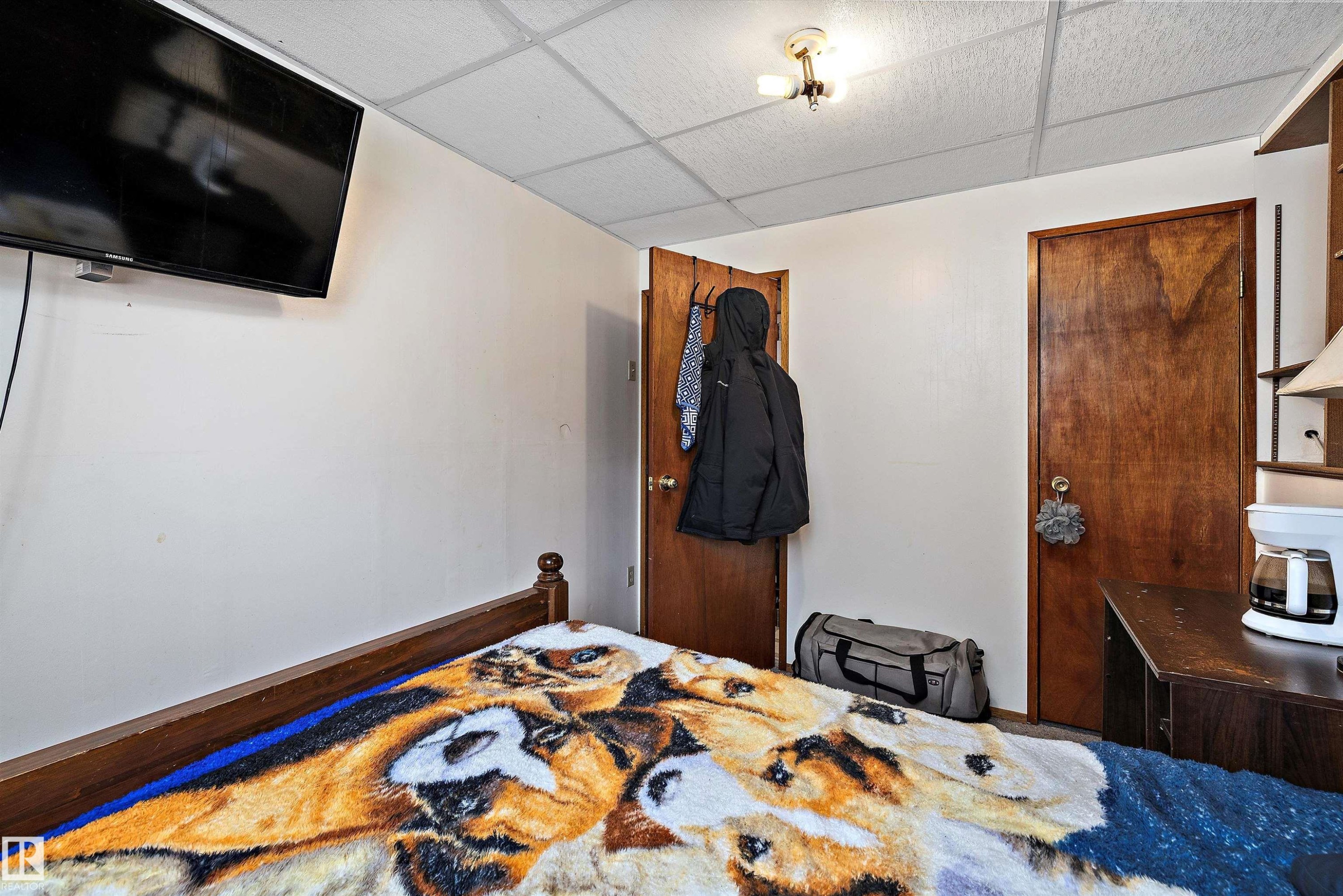 Bedroom with a paneled ceiling and baseboards - 12117 91 Street, Edmonton, AB - Indoor Photo Showing Other Room