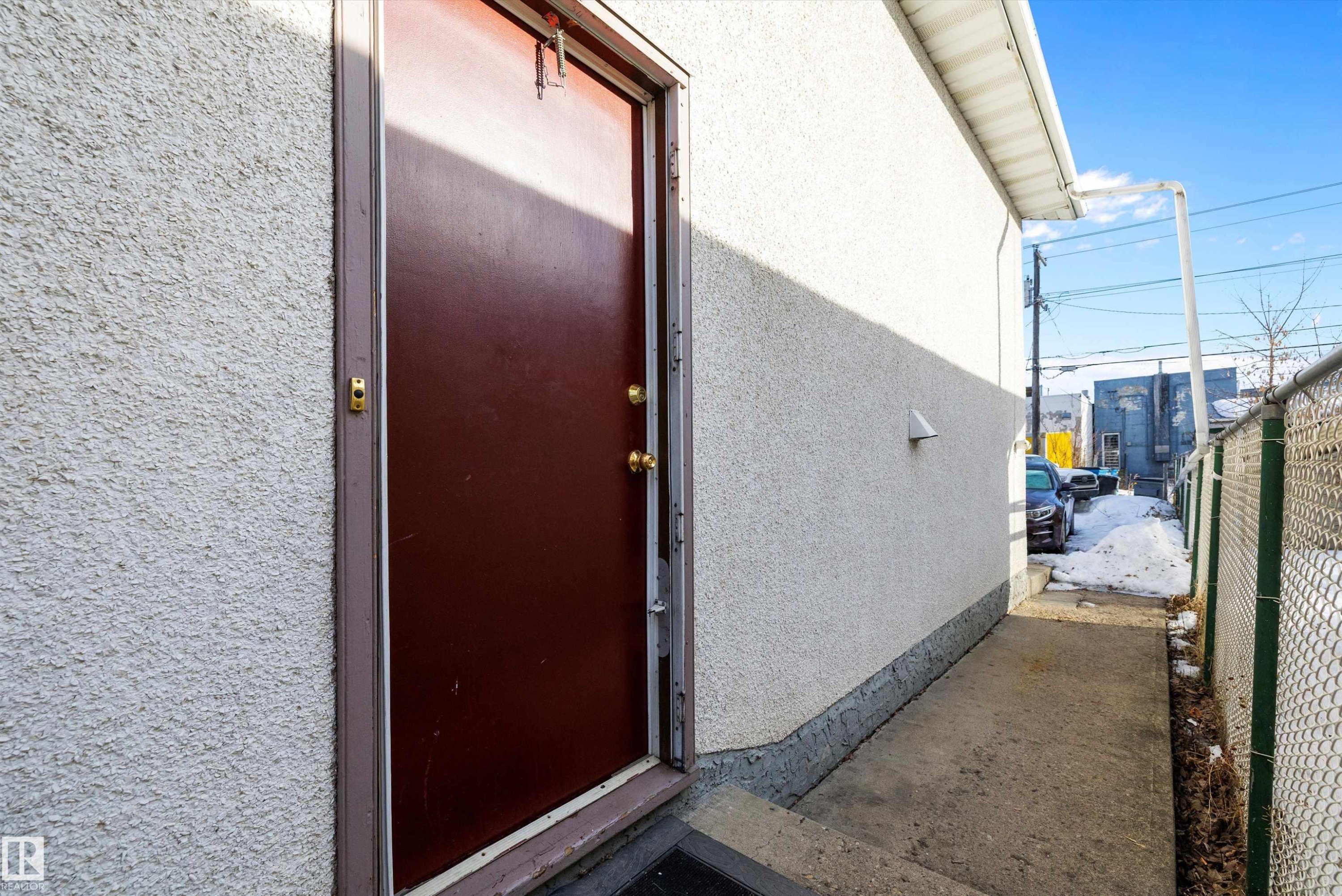 Property entrance with stucco siding - 12117 91 Street, Edmonton, AB - Outdoor With Exterior